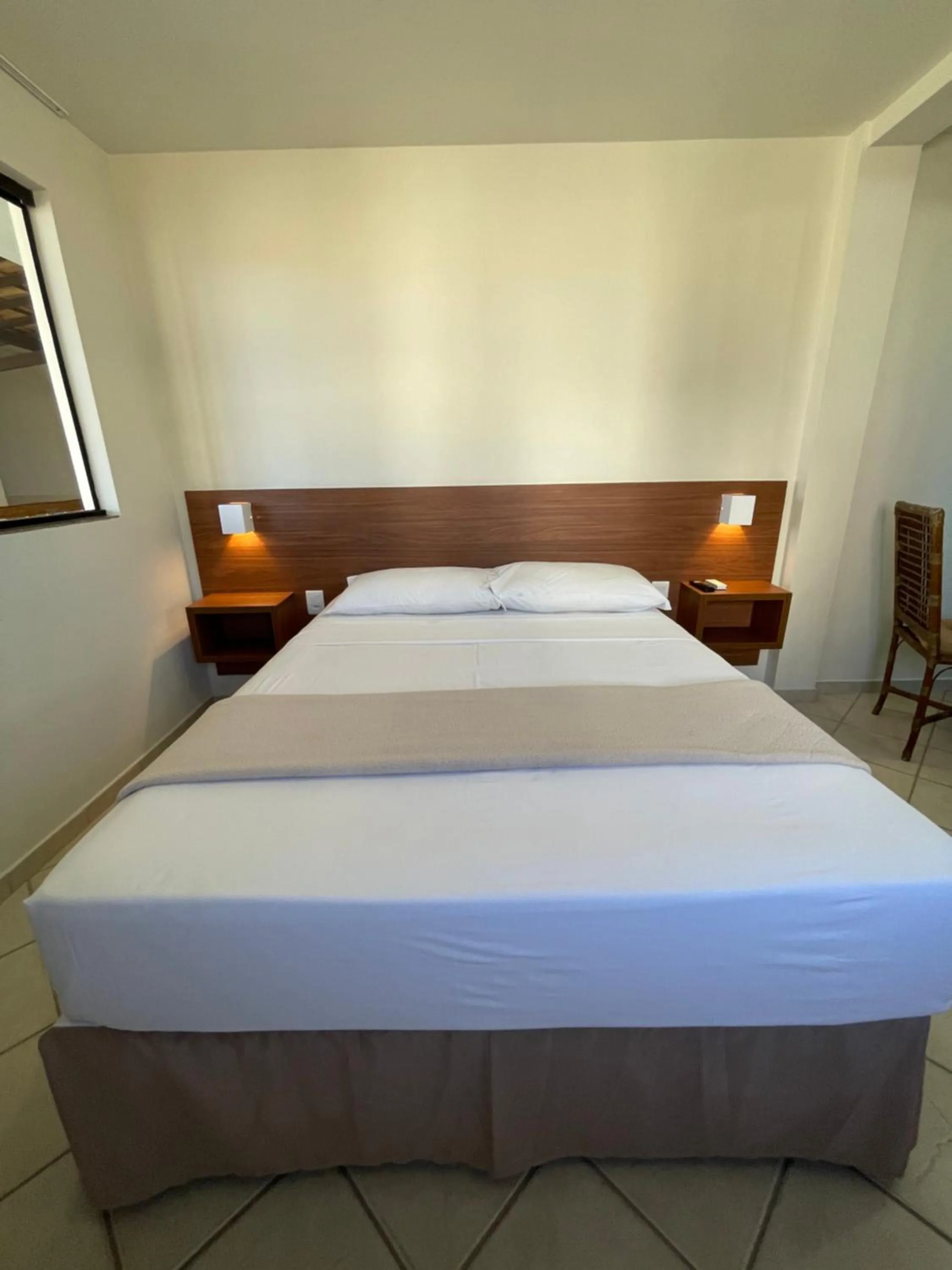 Bed in Pousada Laranja - Nova Administração