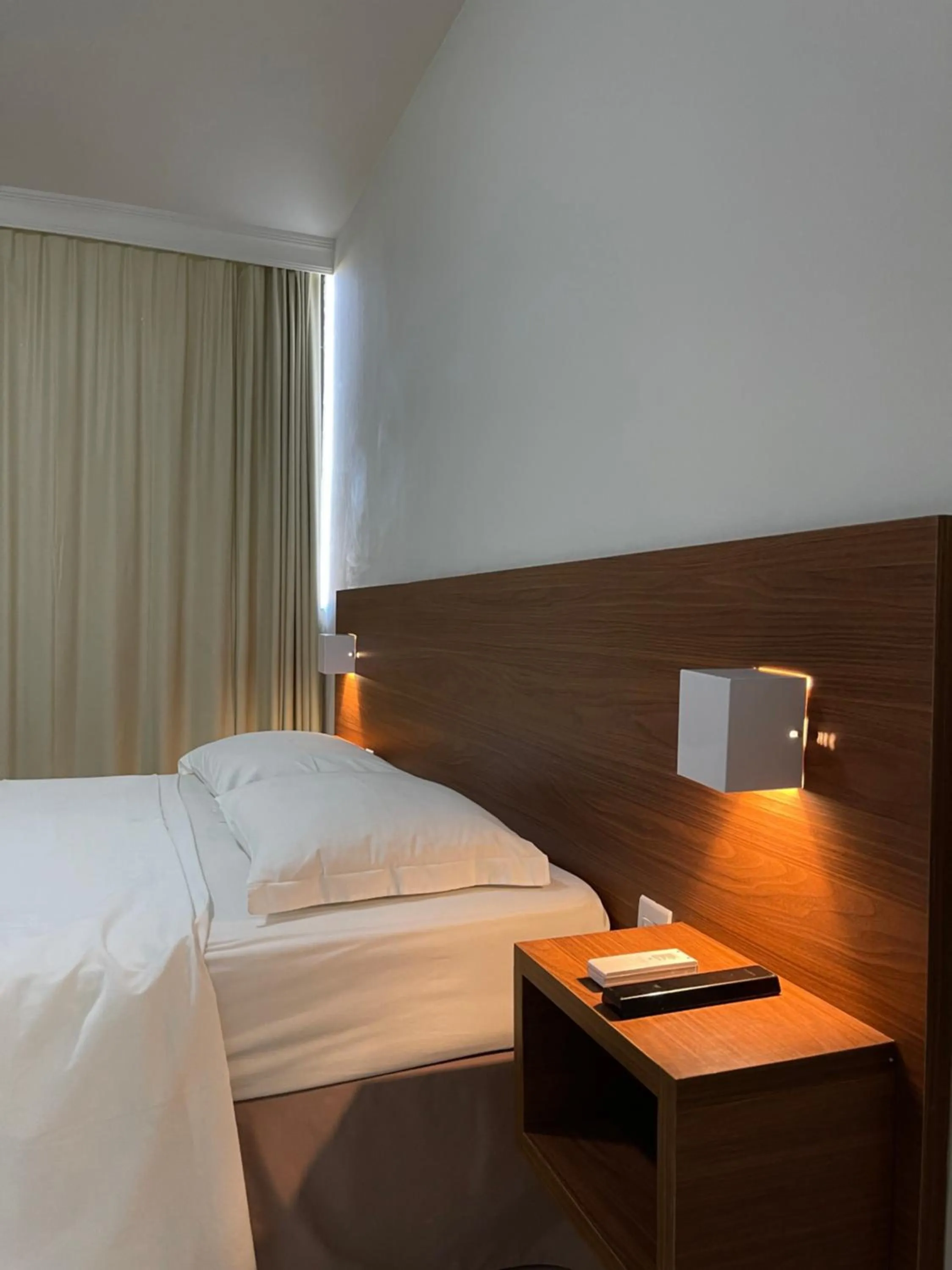 Bed in Pousada Laranja - Nova Administração