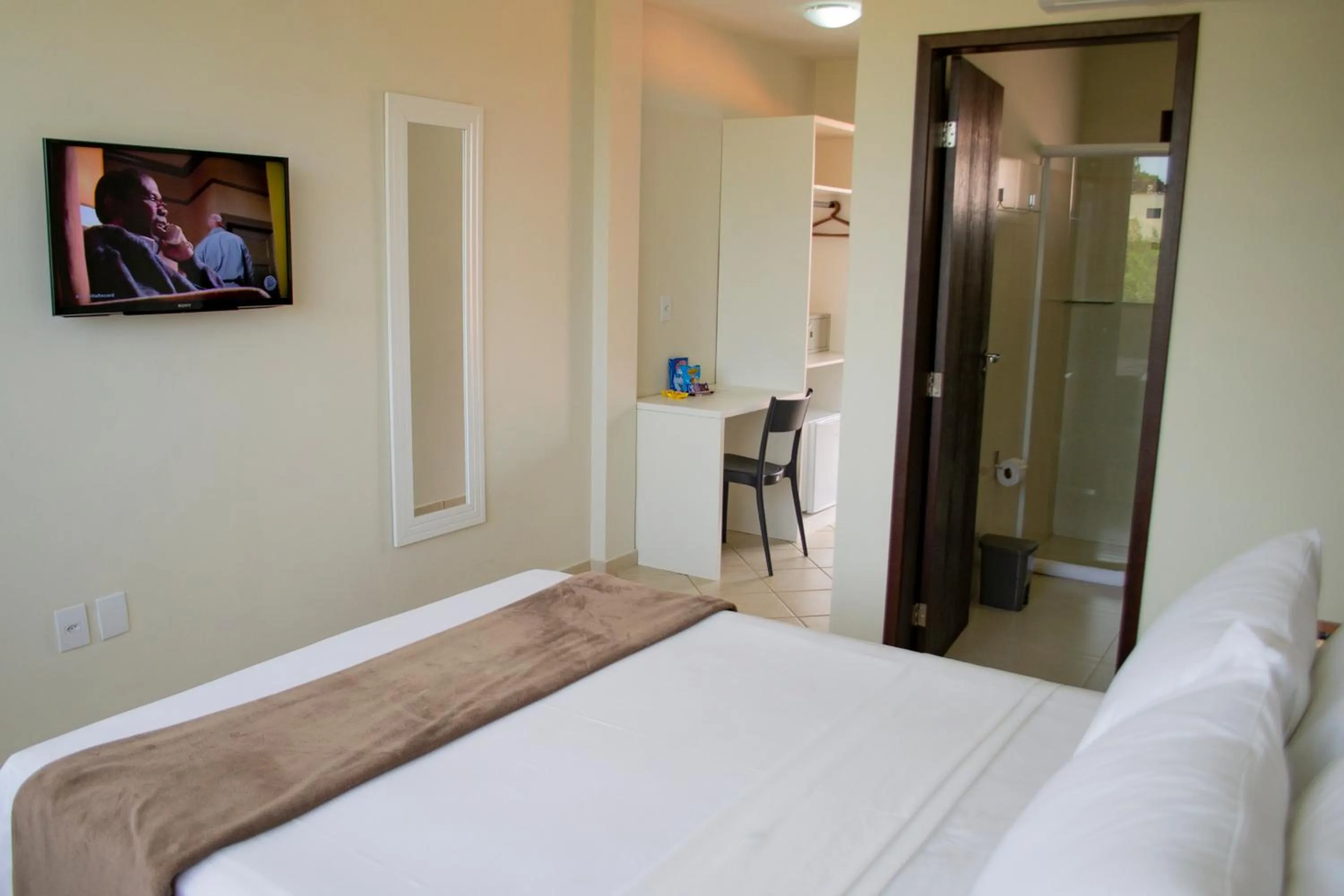 Bed in Pousada Laranja - Nova Administração