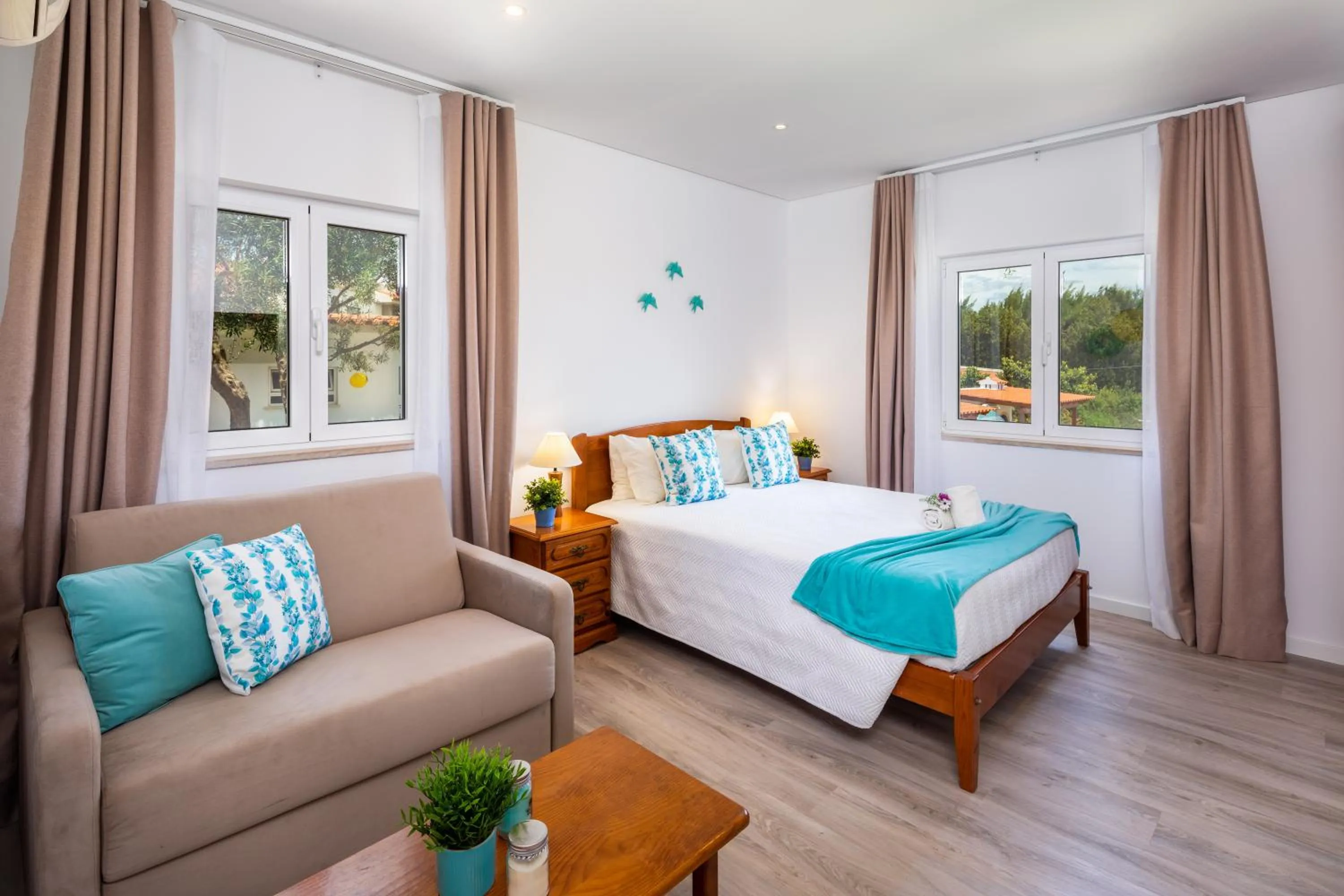 Living room, Bed in Apartamentos Flor da Laranja, Albufeira by AlgarveBlossom