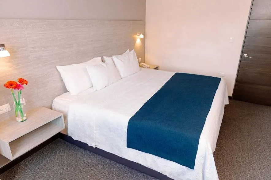 Bed in Kasa Hotel & Suites