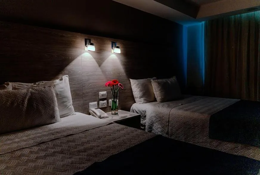 Bed in Kasa Hotel & Suites