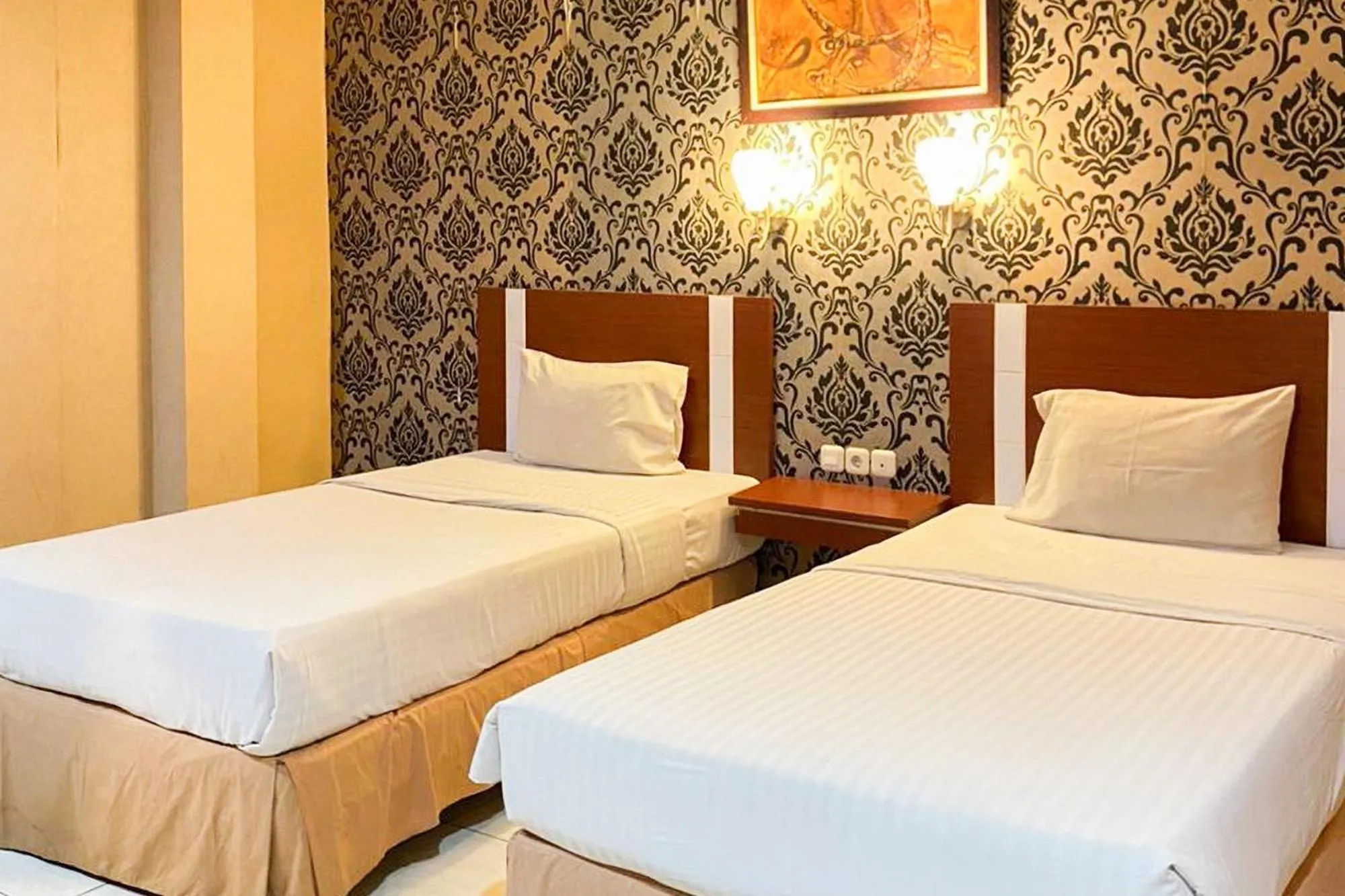 Bedroom, Bed in Urbanview Trisula Hotel Makassar