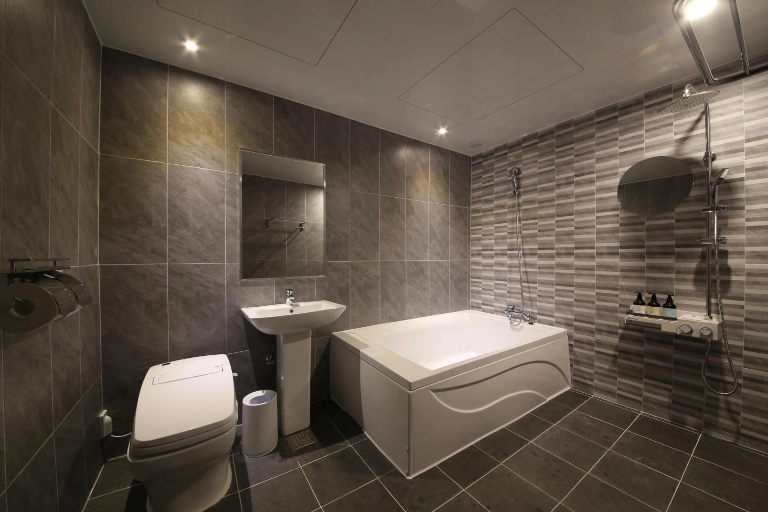 Bathroom in almond hotel Gupo station