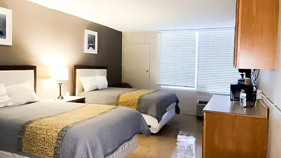 Photo of the whole room, Bed in APM Inn & Suites Photo of the whole room, Bed in APM Inn & Suites