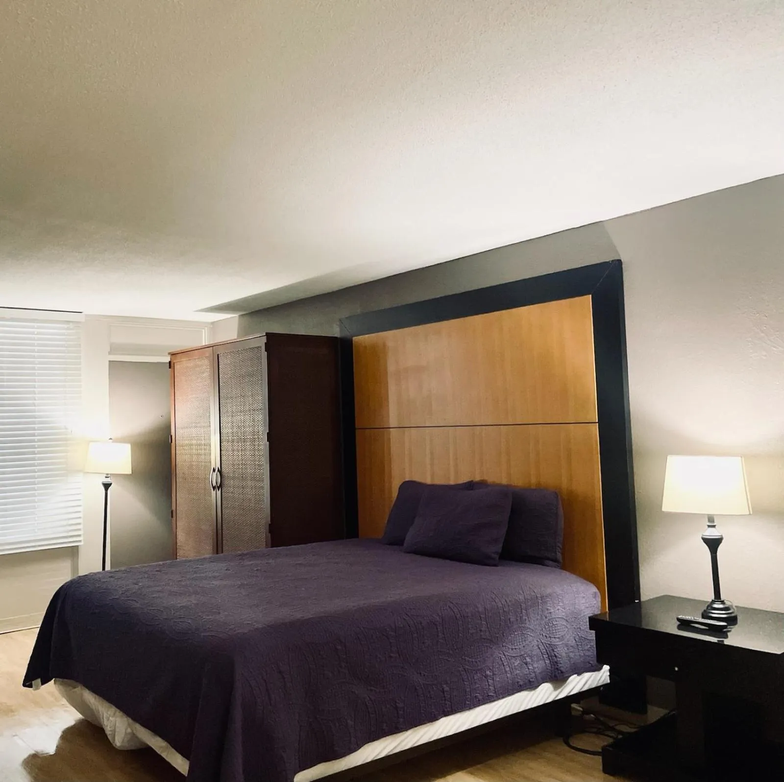 Bed in APM Inn & Suites