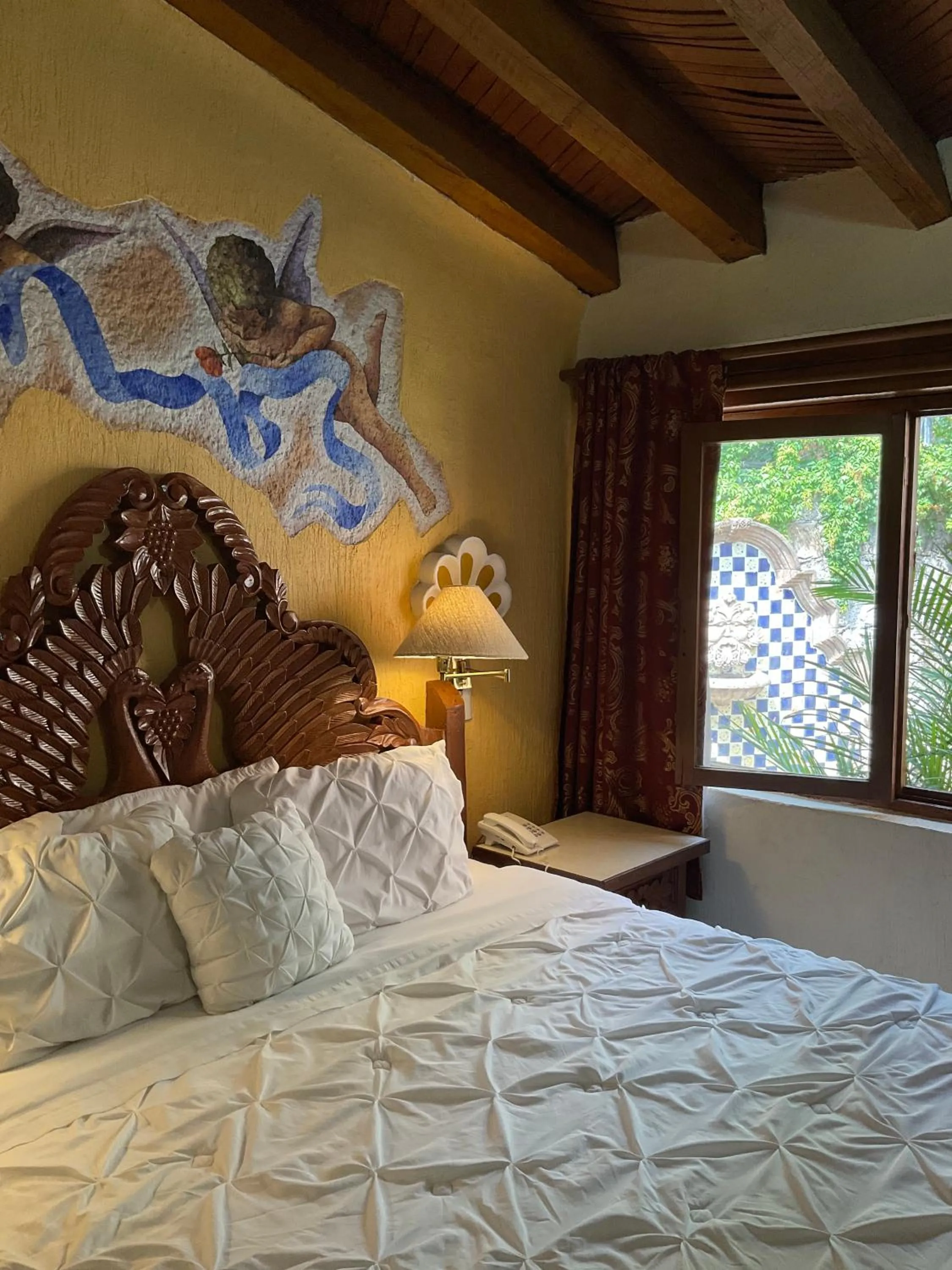 Bed in Villa San Jose Hotel & Suites