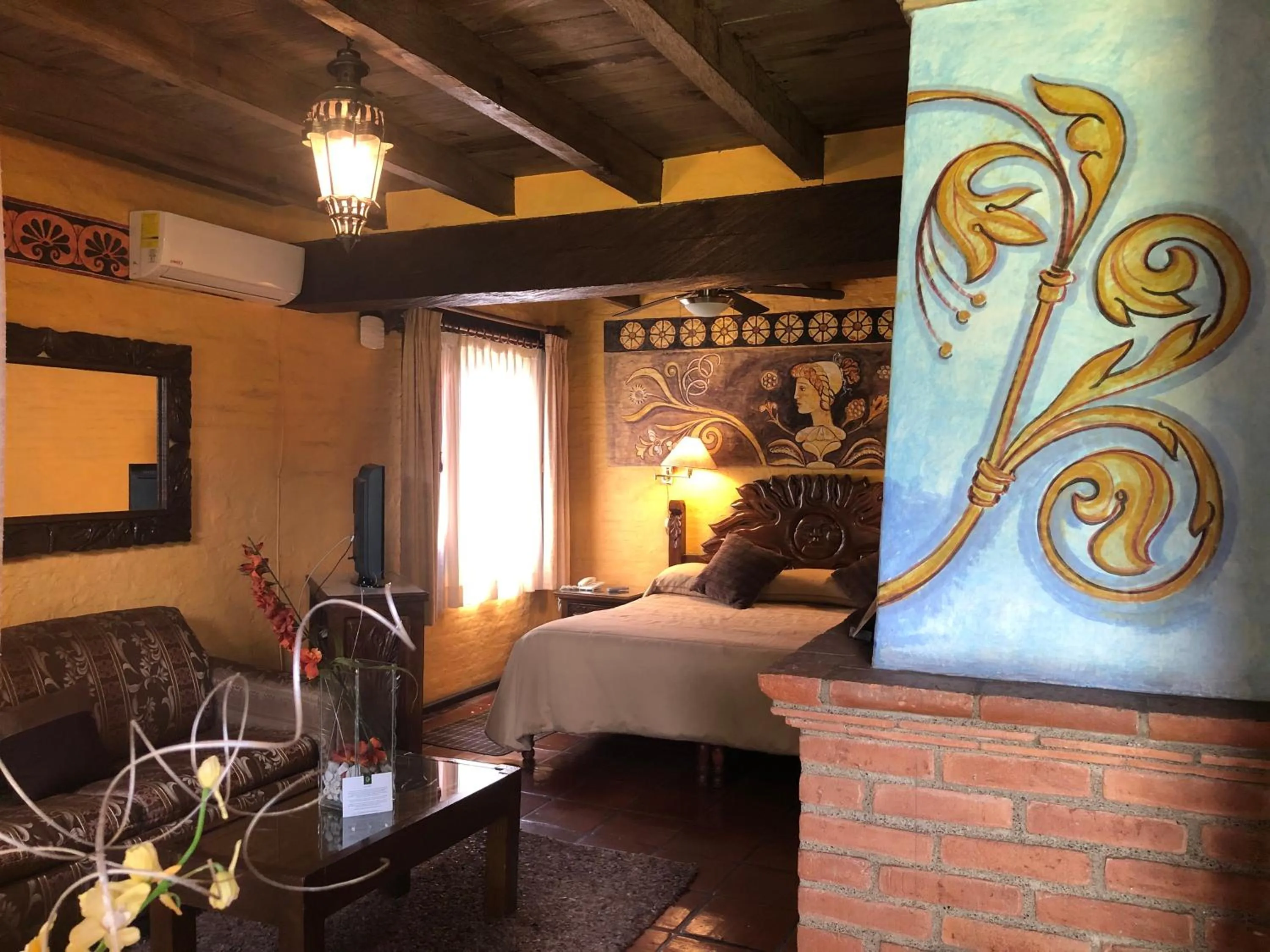 Bed in Villa San Jose Hotel & Suites