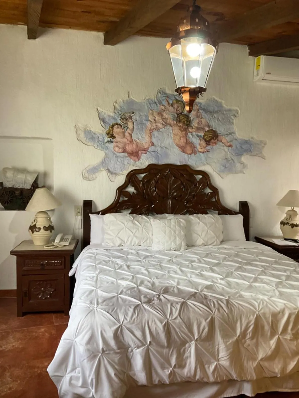 Bed in Villa San Jose Hotel & Suites