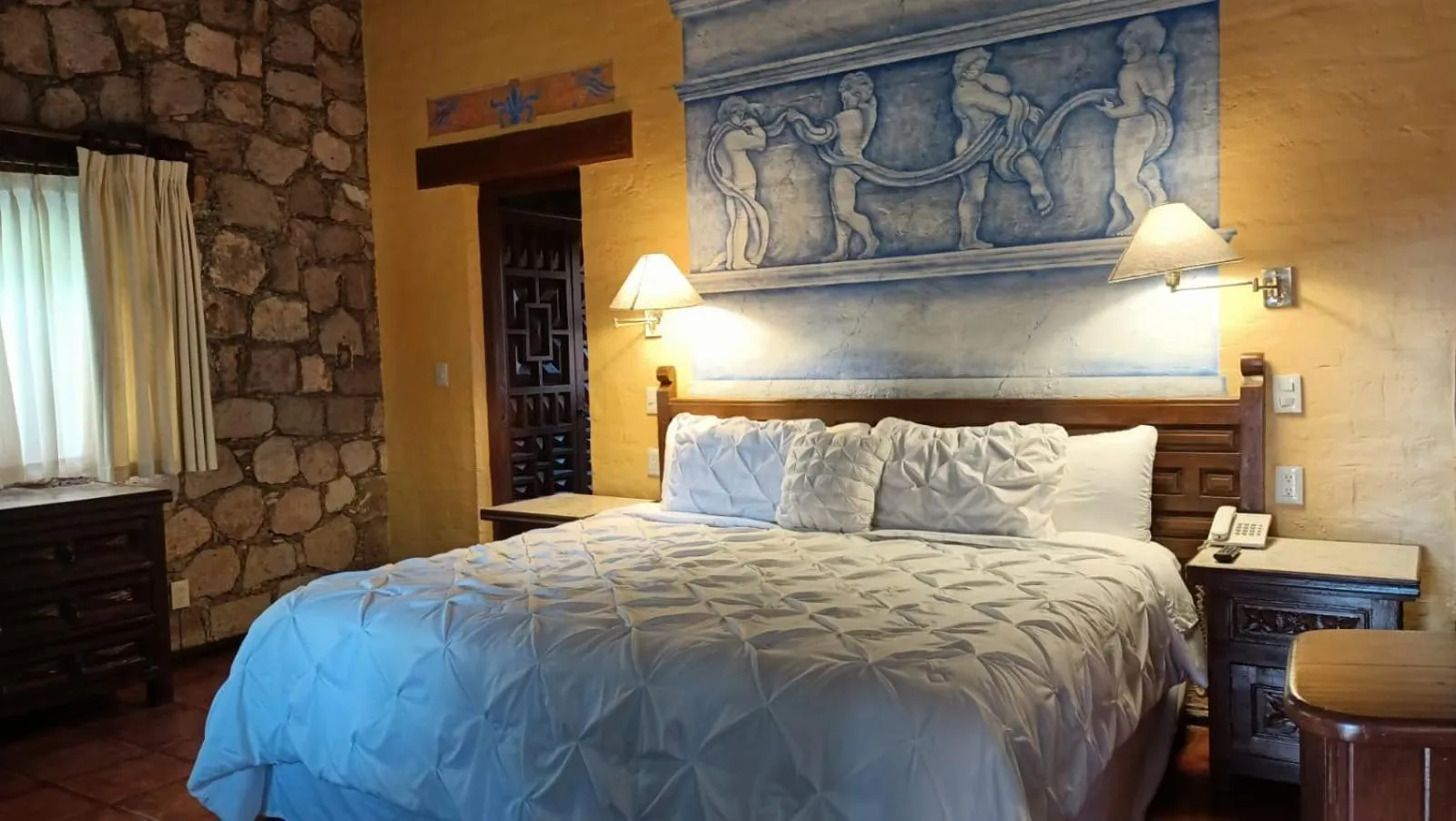 Bed in Villa San Jose Hotel & Suites