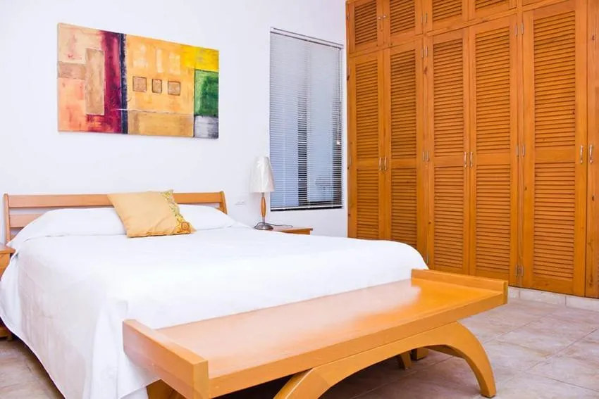 Bed in Villas Mayaluum Cozumel