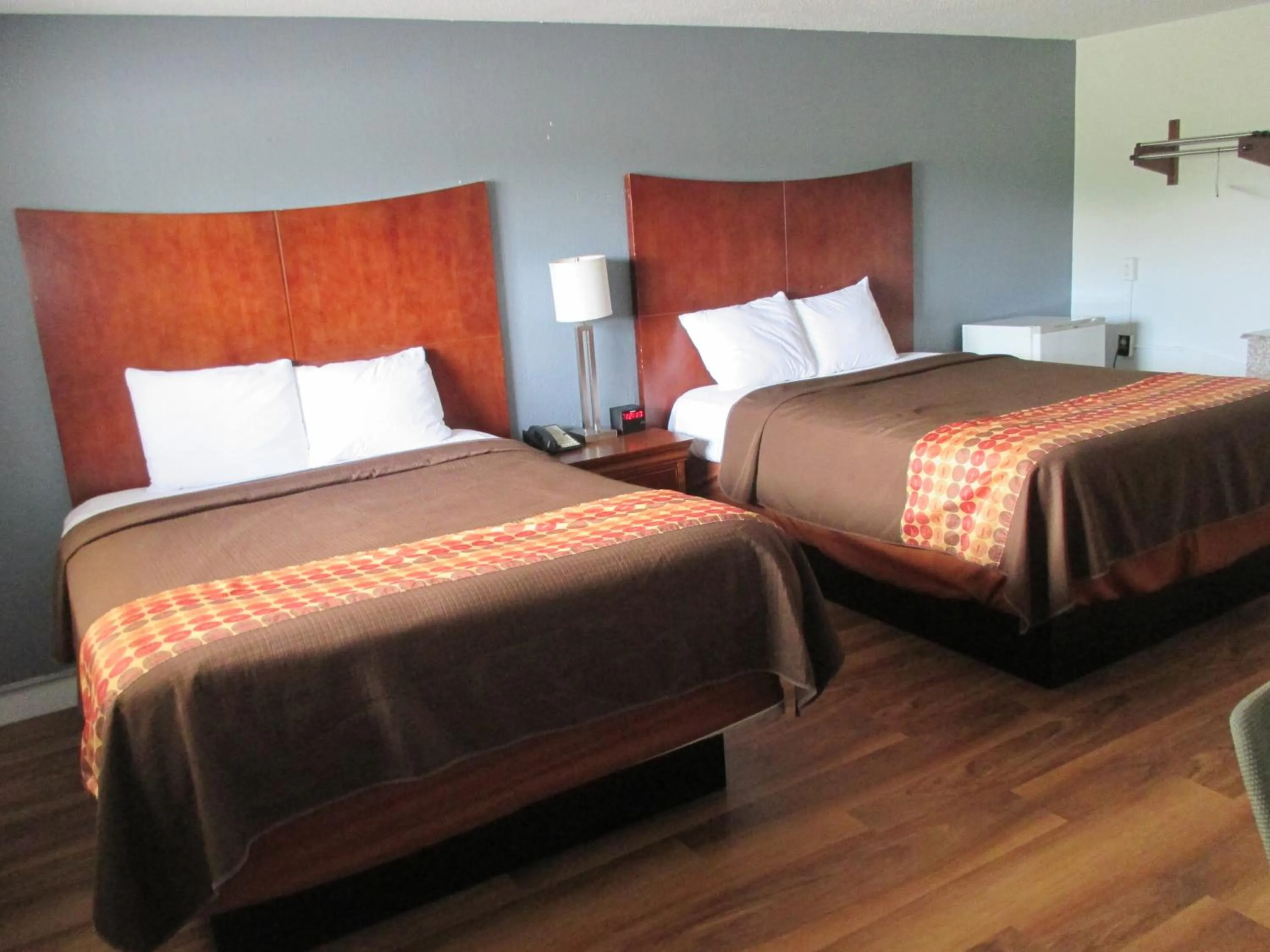 Bed in Travel Inn and Suites