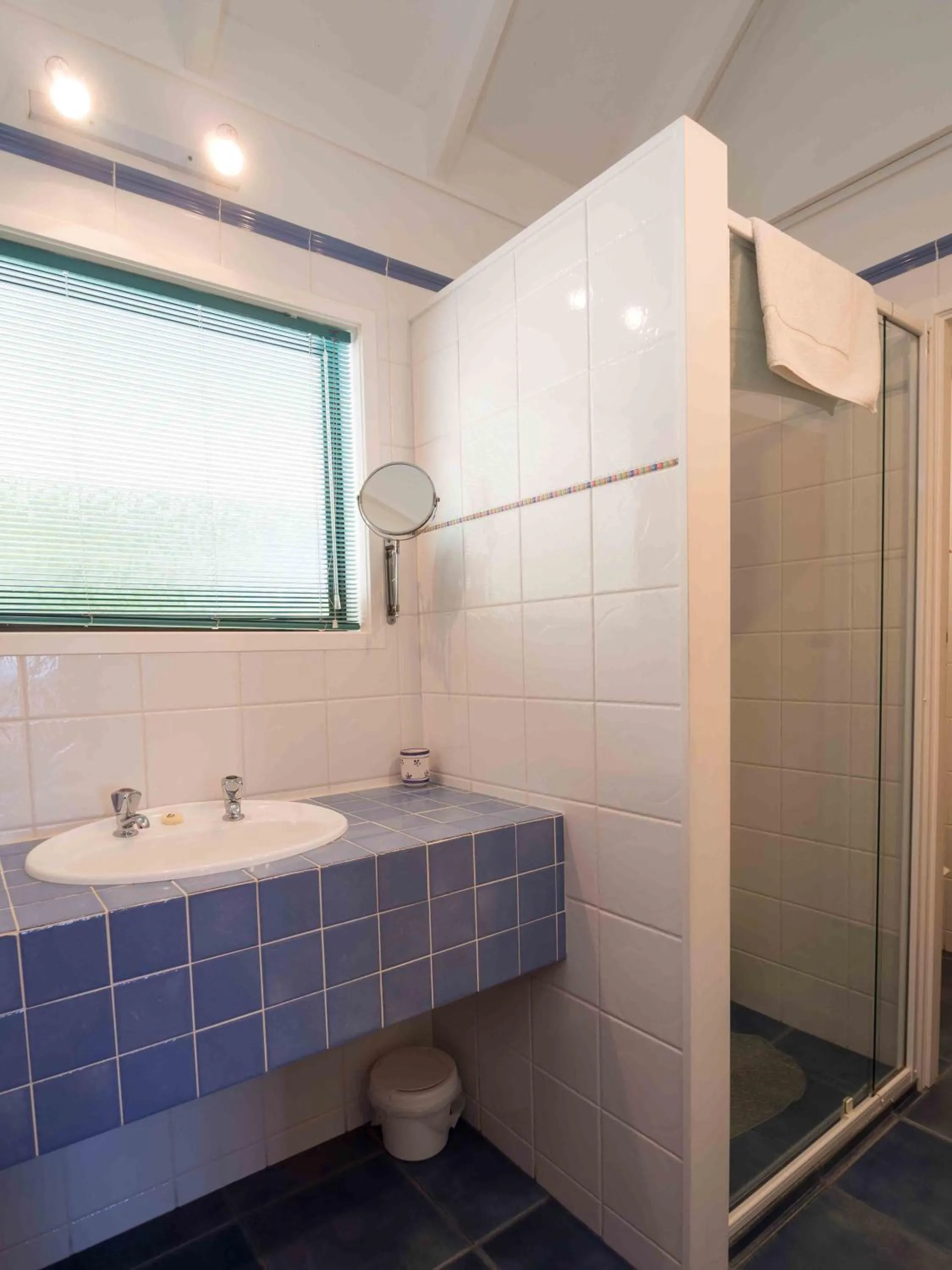 Bathroom in By the Bay Beachfront Apartments
