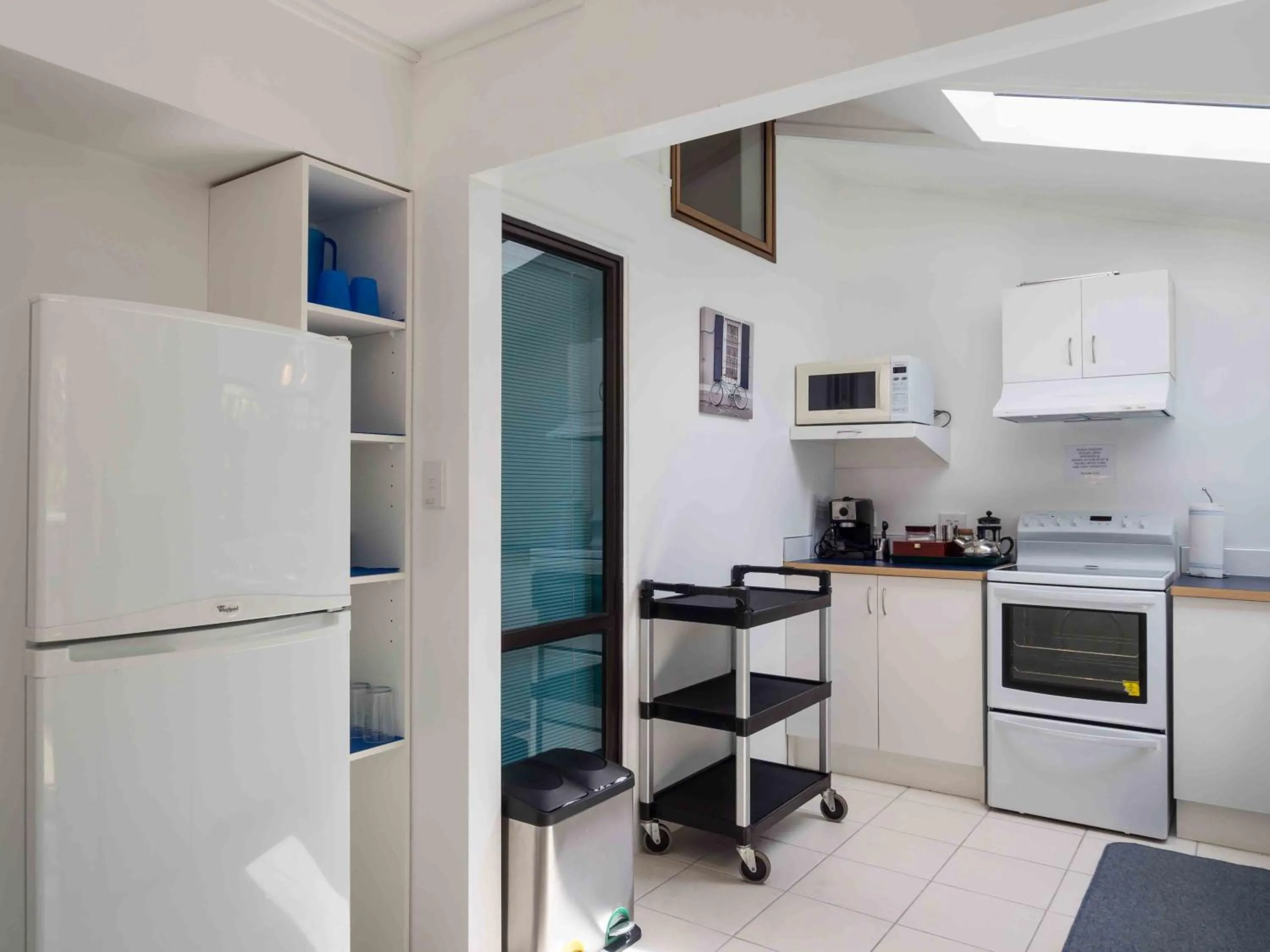 Kitchen or kitchenette in By the Bay Beachfront Apartments