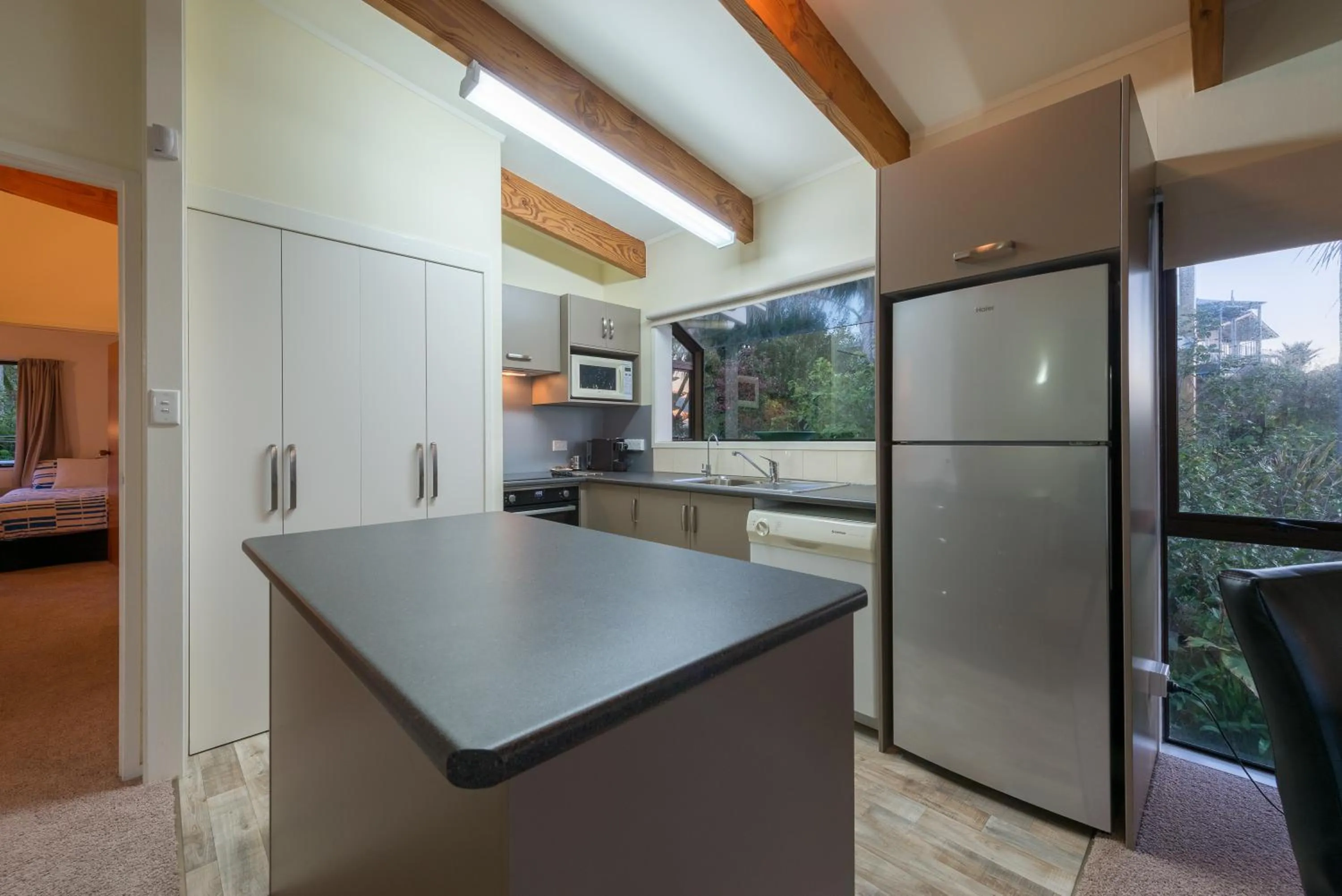 Kitchen or kitchenette in By the Bay Beachfront Apartments