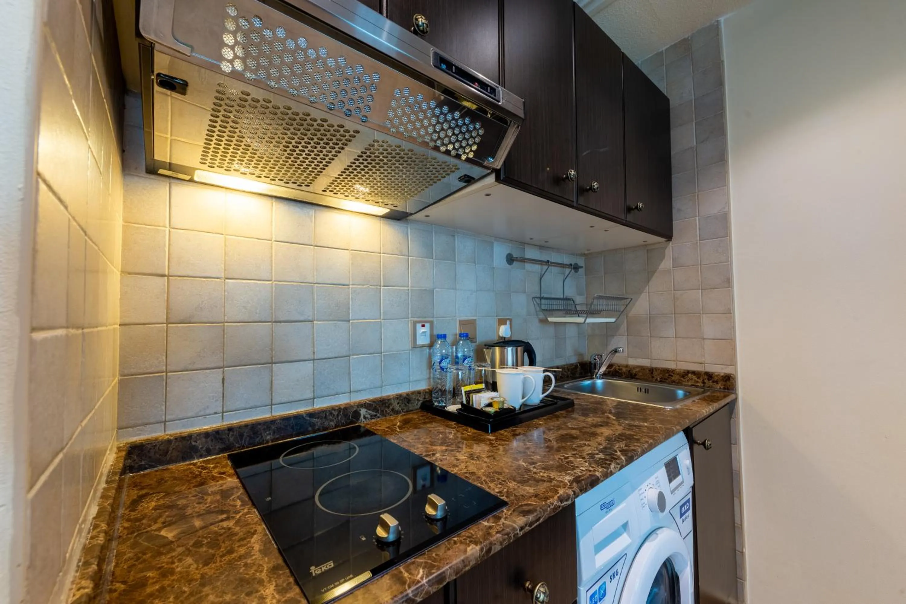 Kitchen or kitchenette in First Central Hotel Suites