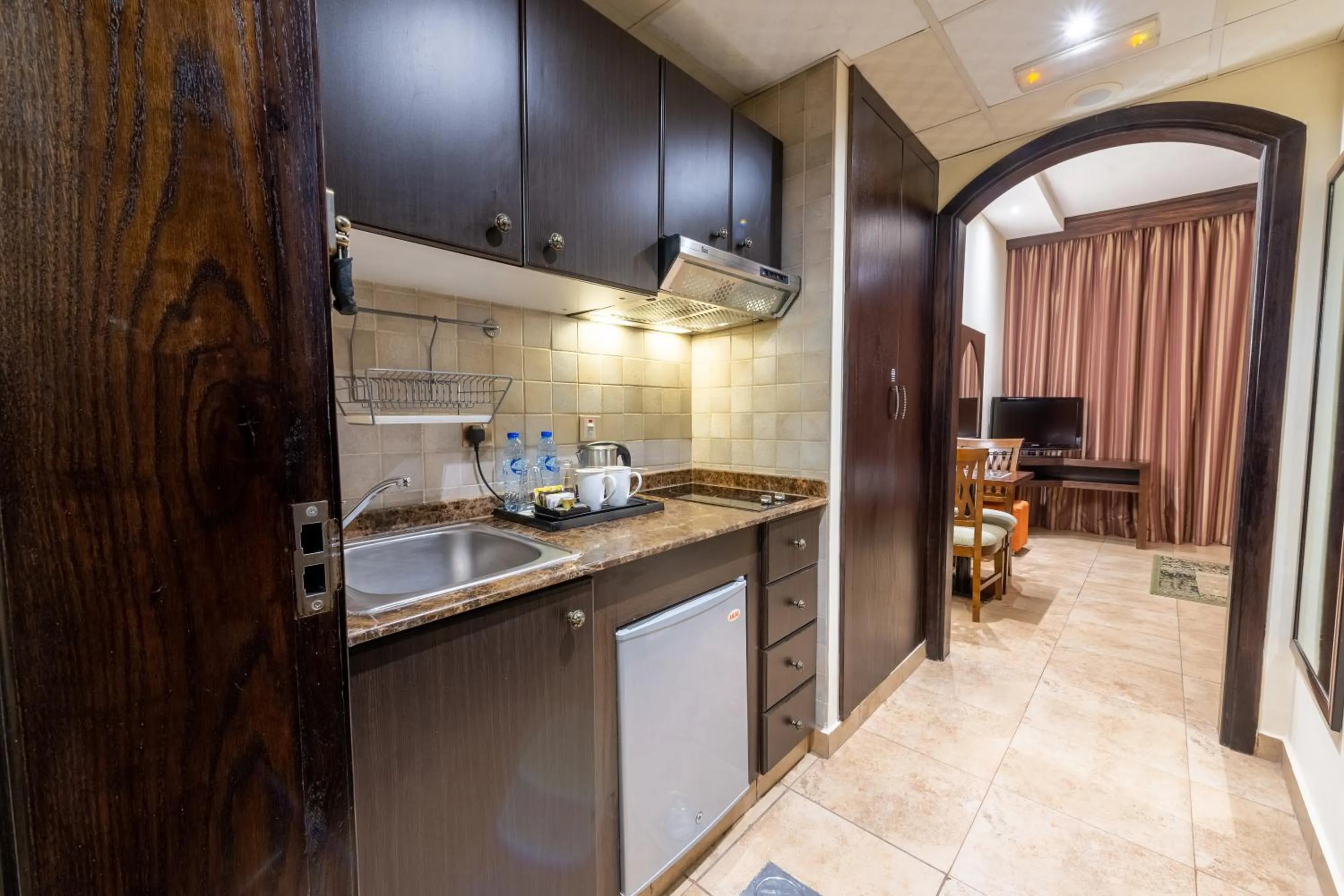 Kitchen or kitchenette in First Central Hotel Suites
