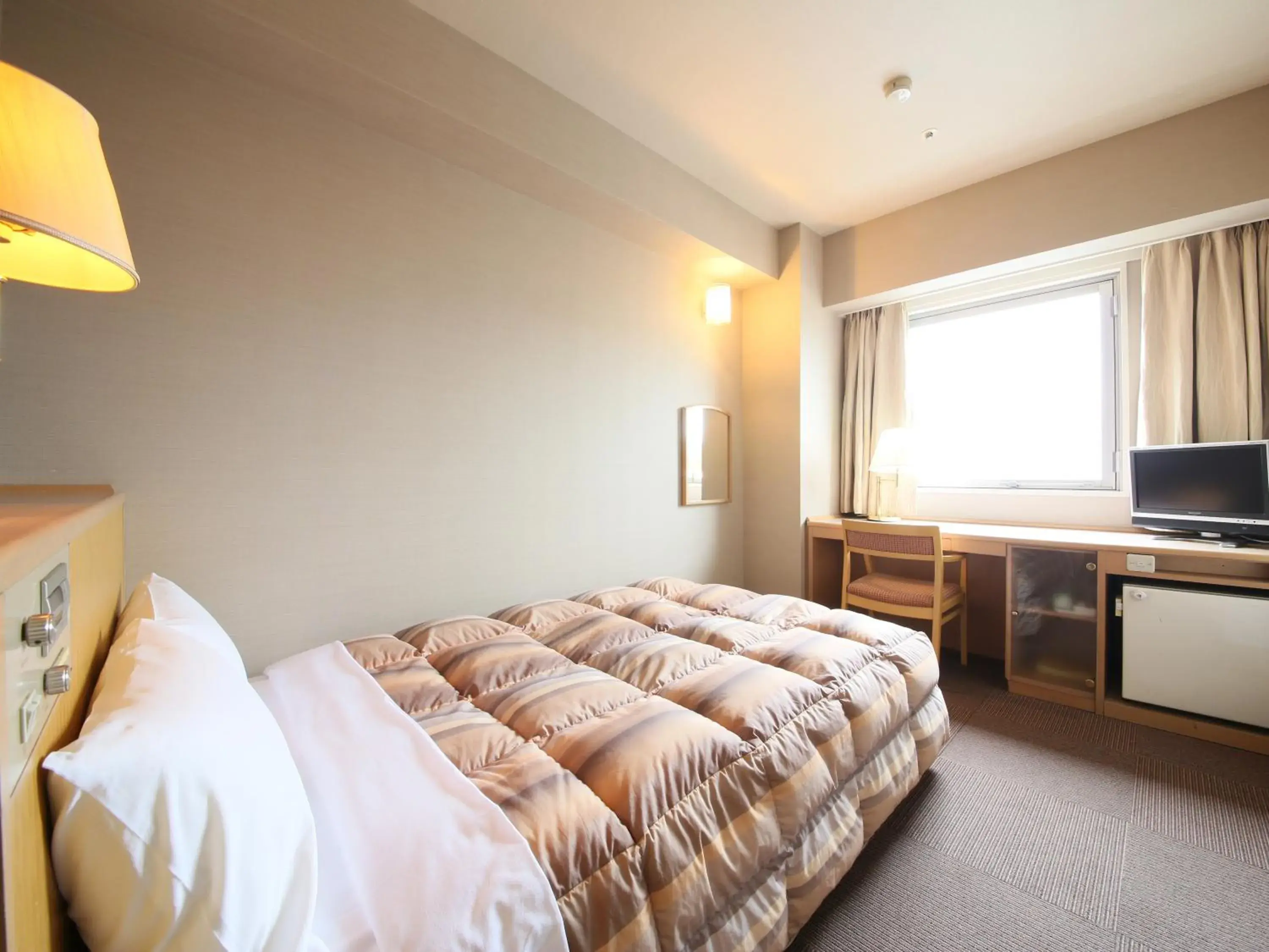 Bed in Rako Hananoi Hotel Bed in Rako Hananoi Hotel