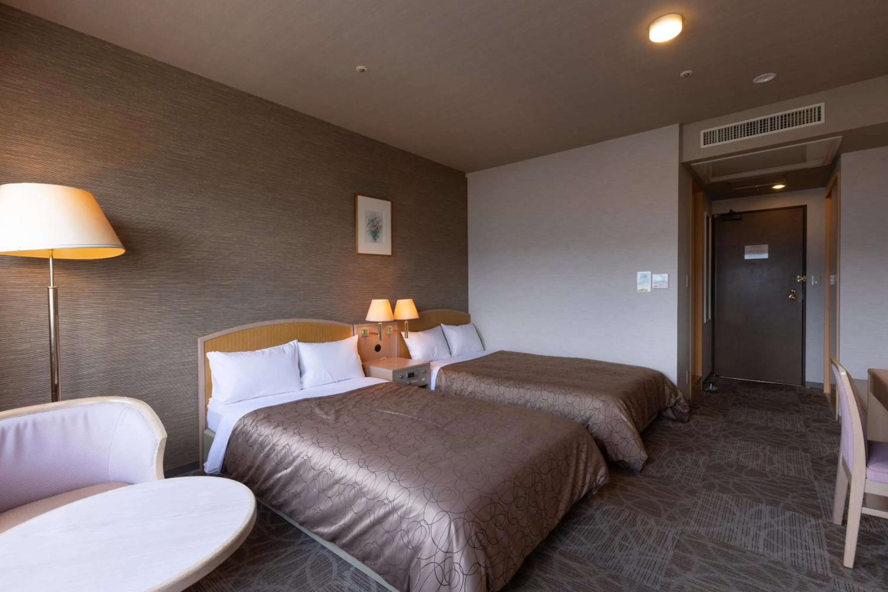 Bed in Rako Hananoi Hotel