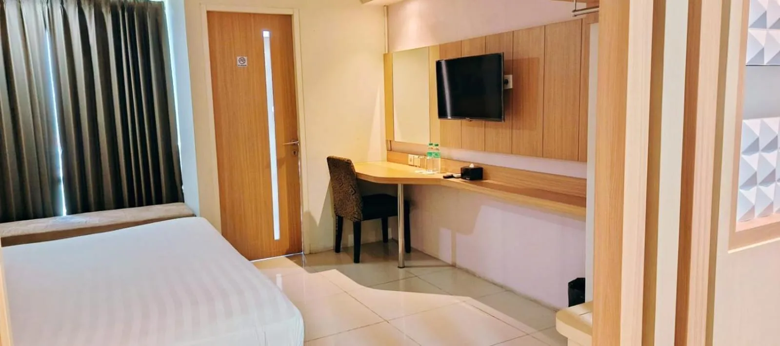 Bed in The Square Surabaya Hotel