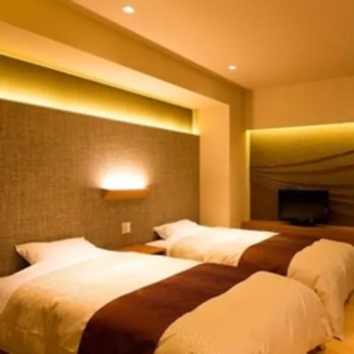 Bed in Kaike Grand Hotel Tensui