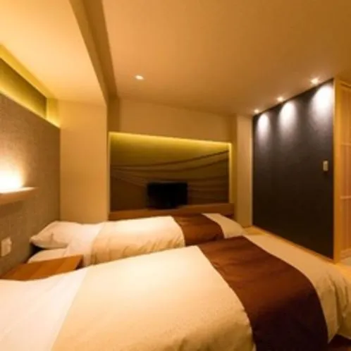 Bed in Kaike Grand Hotel Tensui