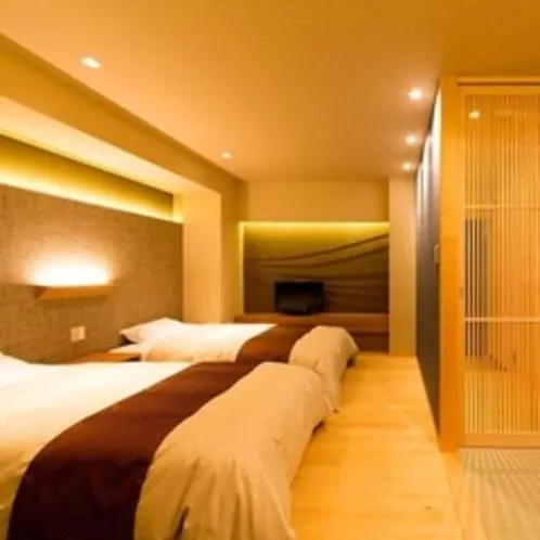 Bed in Kaike Grand Hotel Tensui