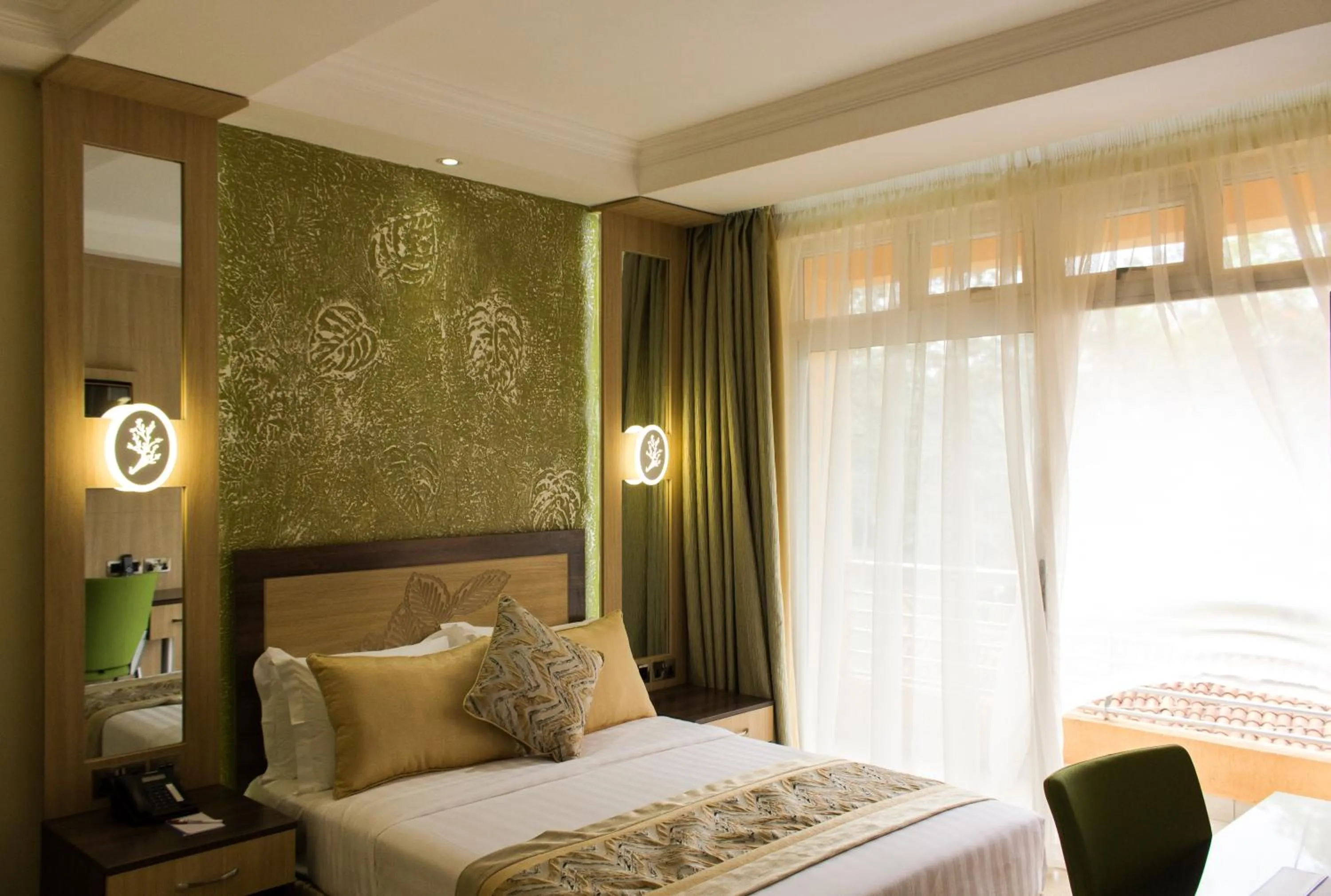 Bed in Elysian Resort