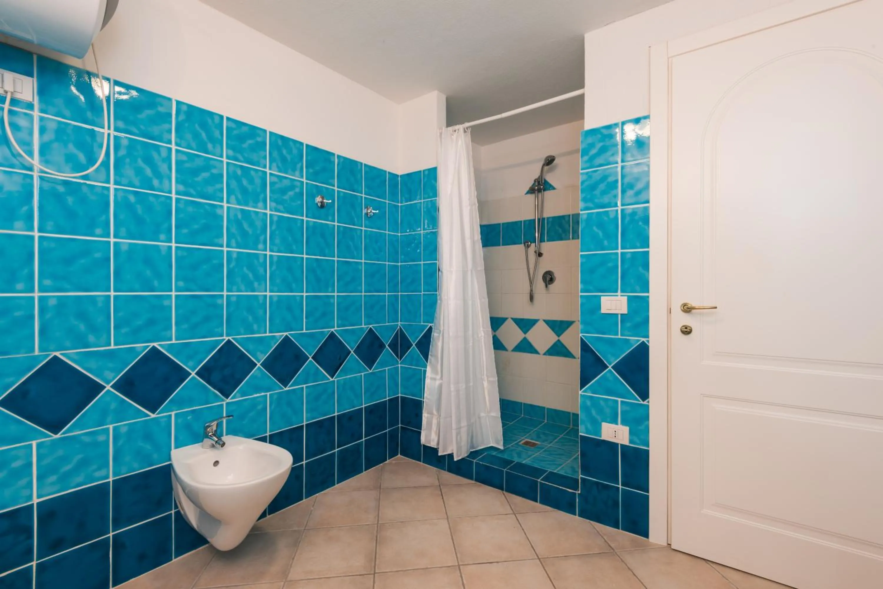 Shower in Apartment in S'Abba e Sa Pedra complex with pool