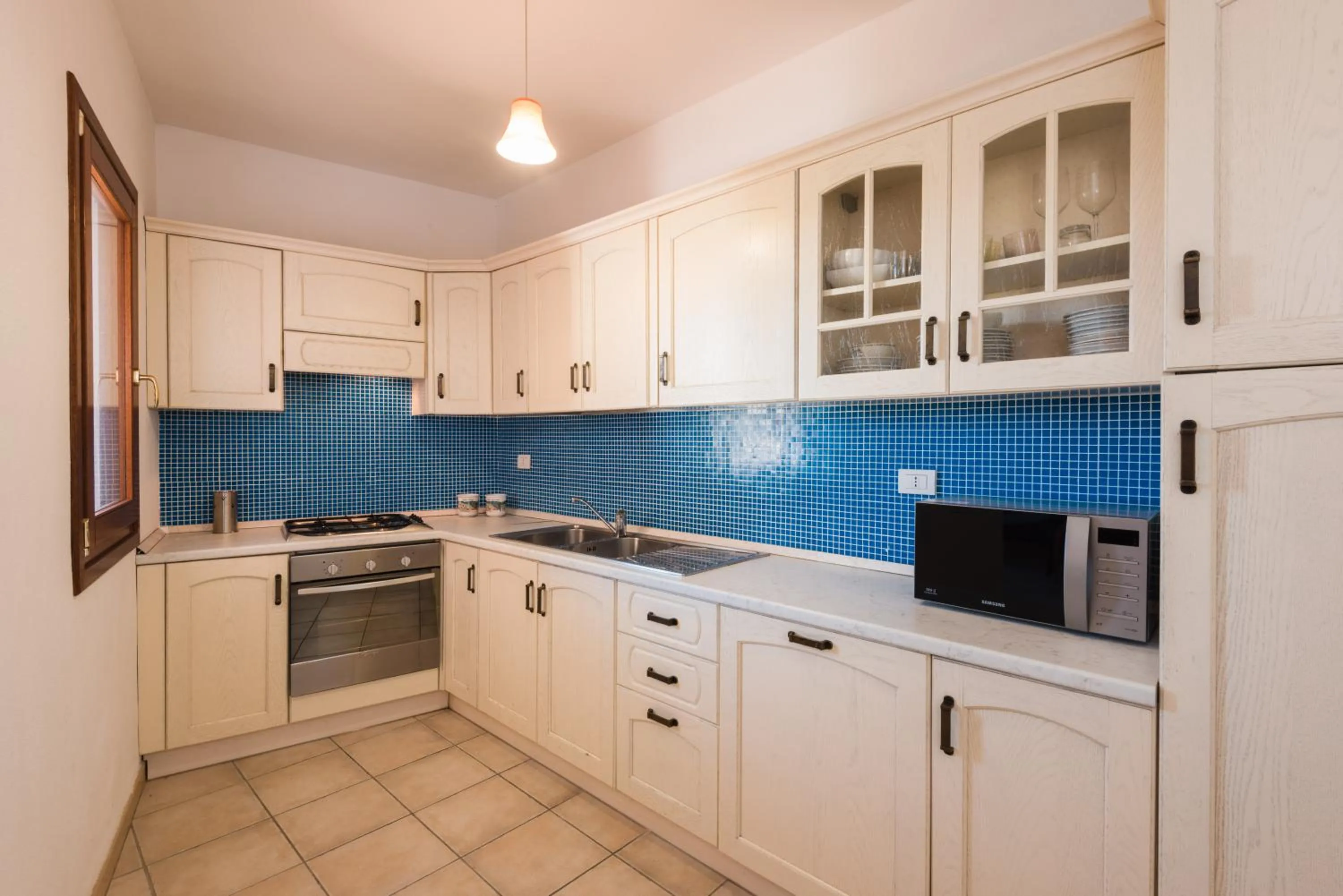 Kitchen or kitchenette in Apartment in S'Abba e Sa Pedra complex with pool