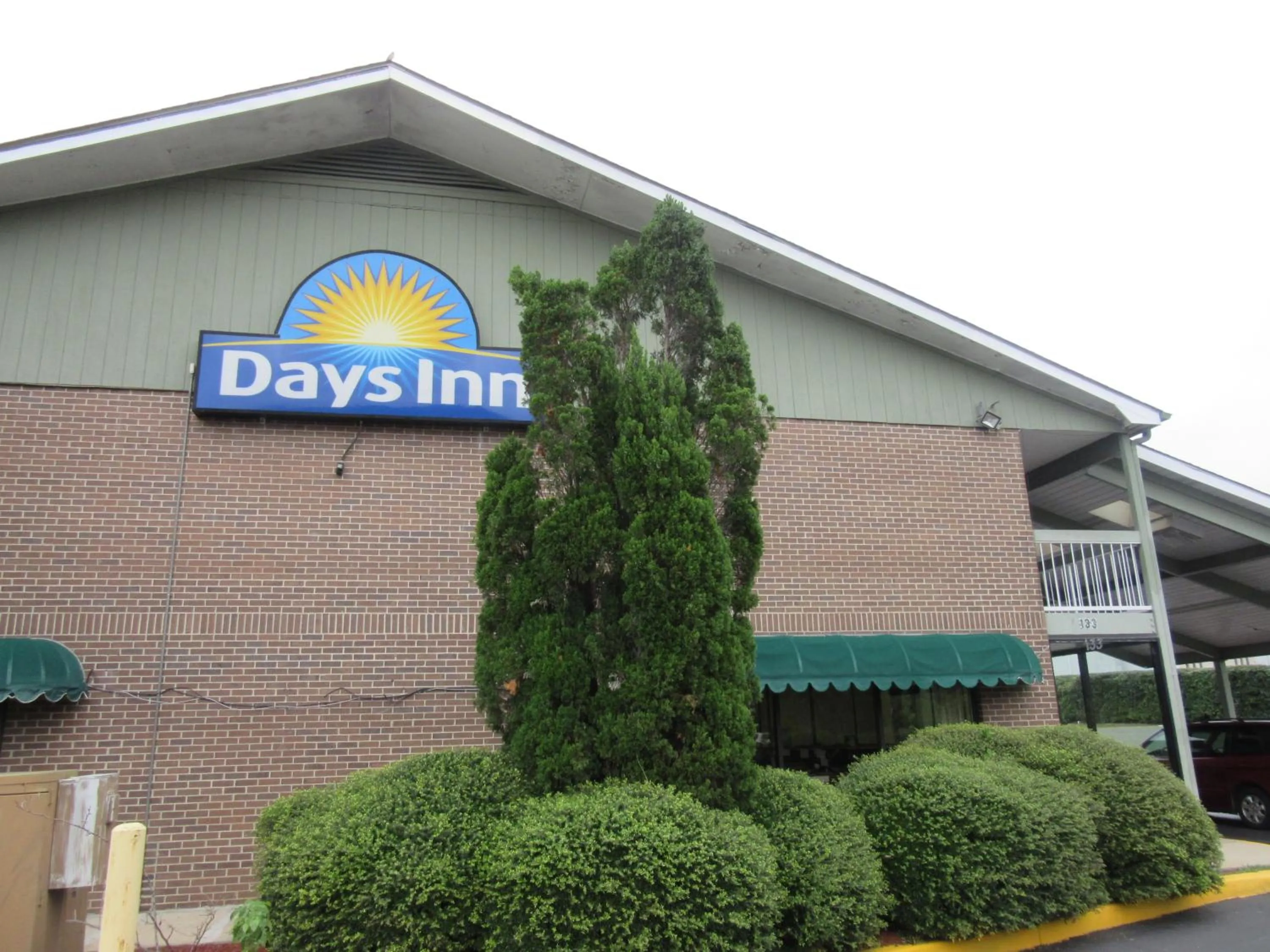 Property logo or sign in Days Inn by Wyndham Columbia NE Fort Jackson
