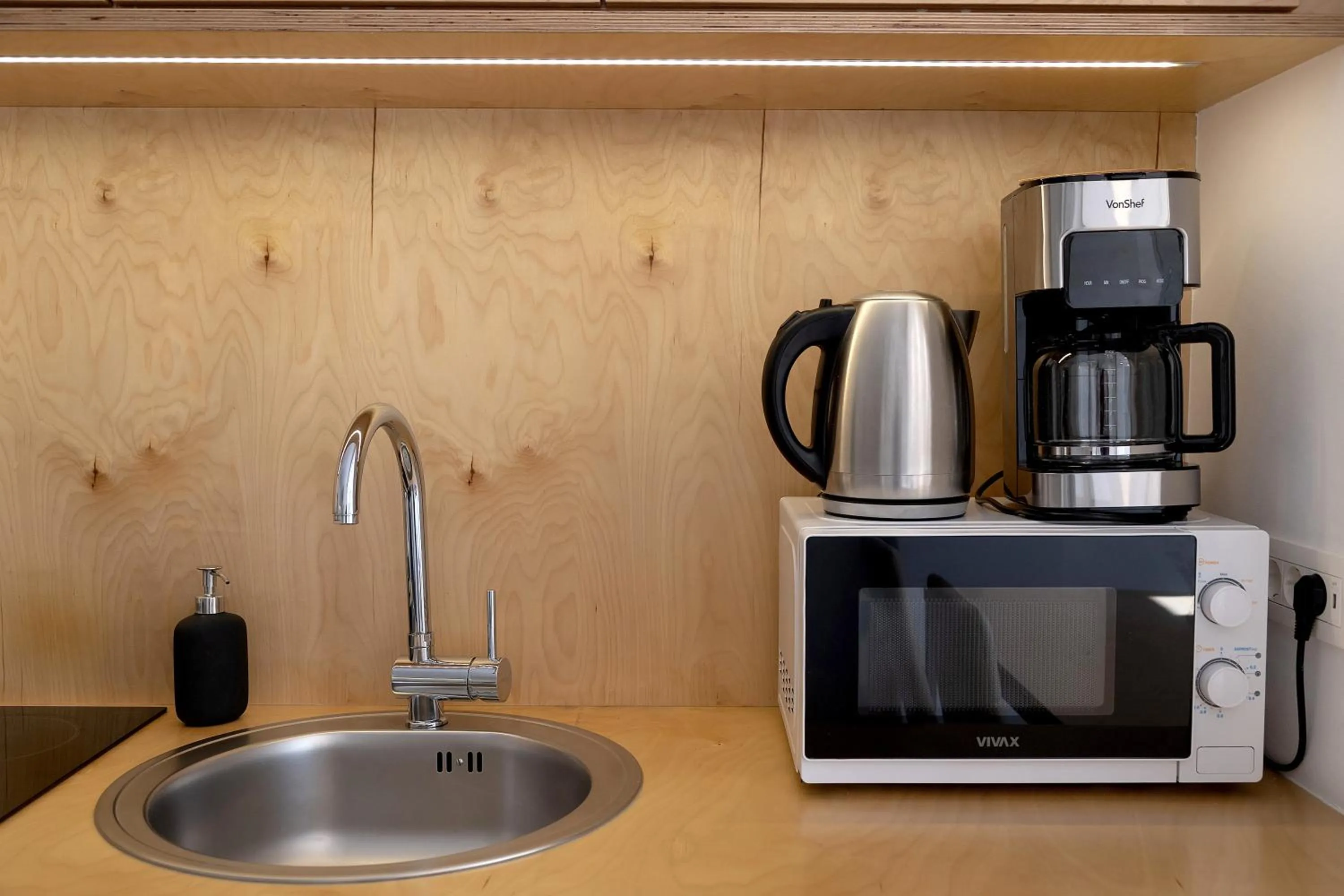 Kitchen or kitchenette in Pekarna apartments