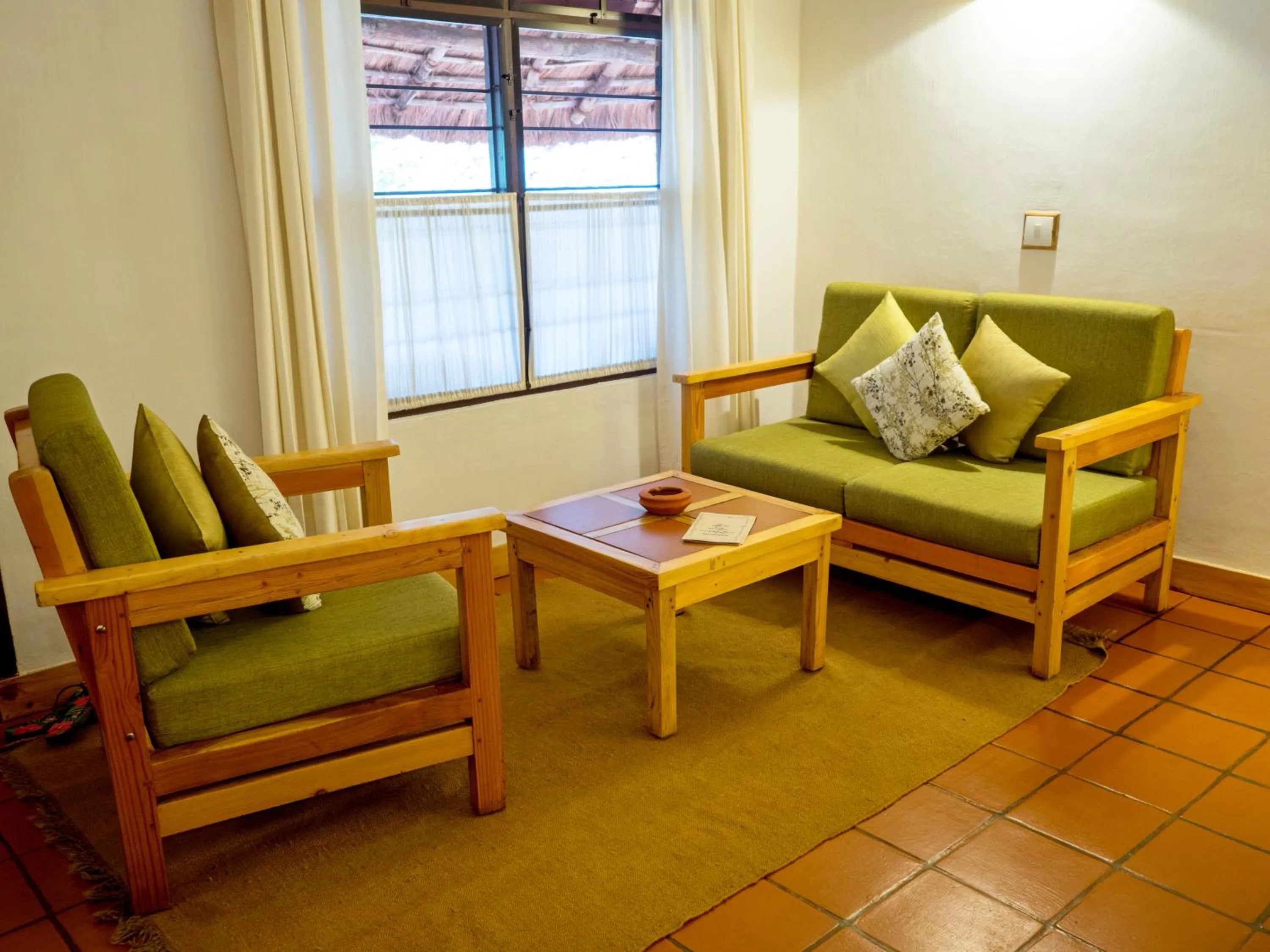 Seating area in Spice Village Thekkady - A CGH Earth Experience