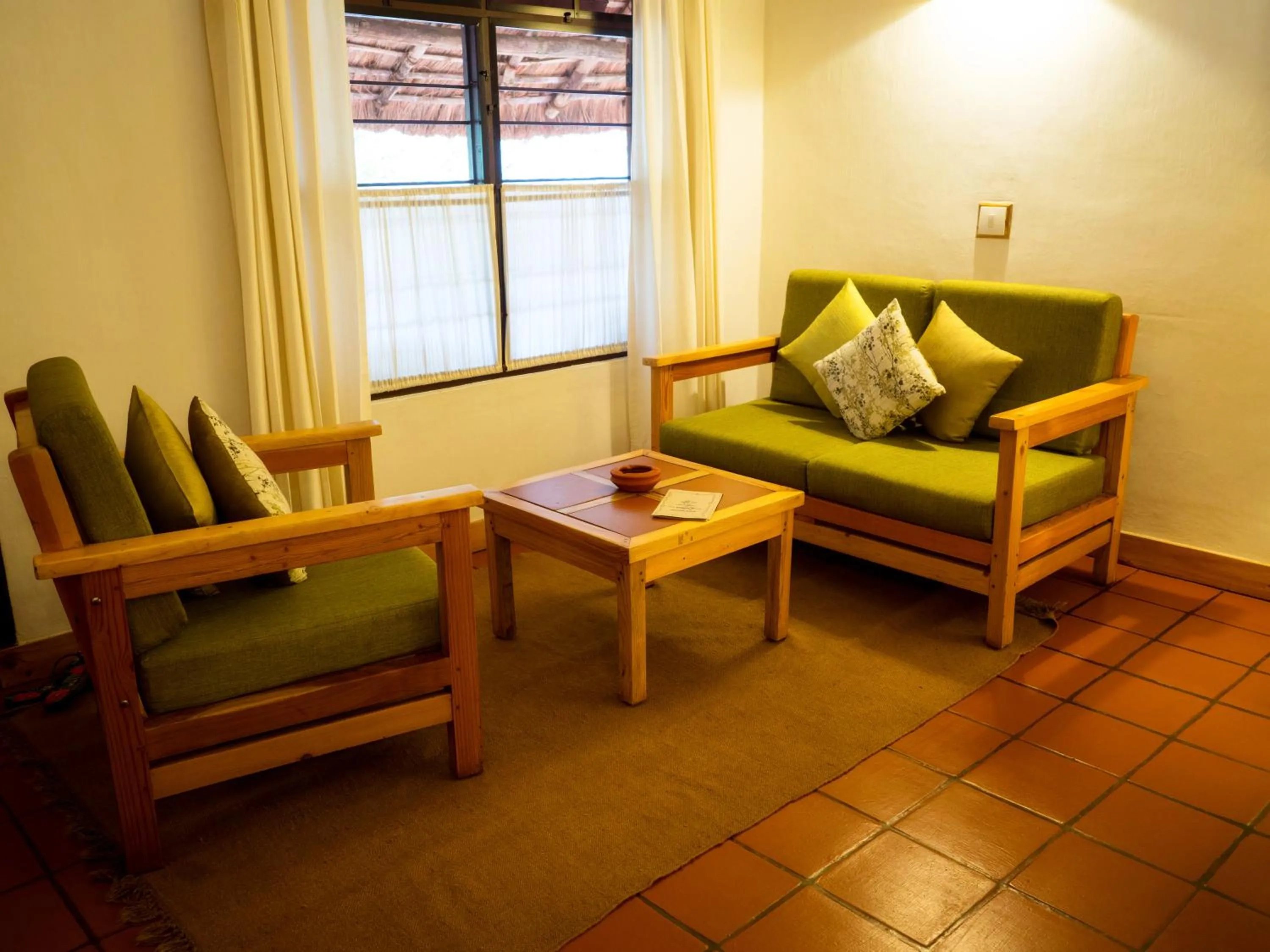 Seating area in Spice Village Thekkady - A CGH Earth Experience