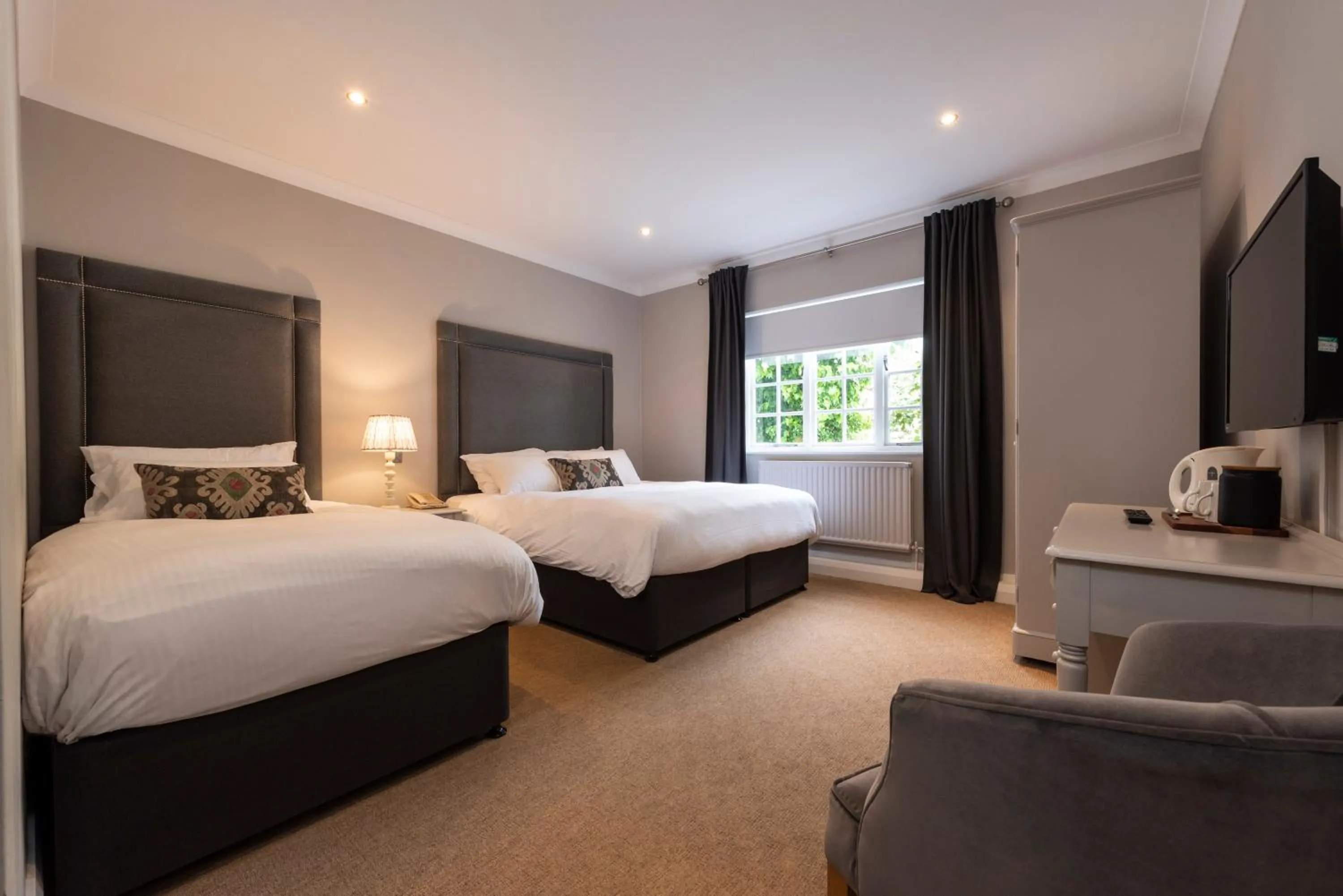 Bed in Statham Lodge Hotel