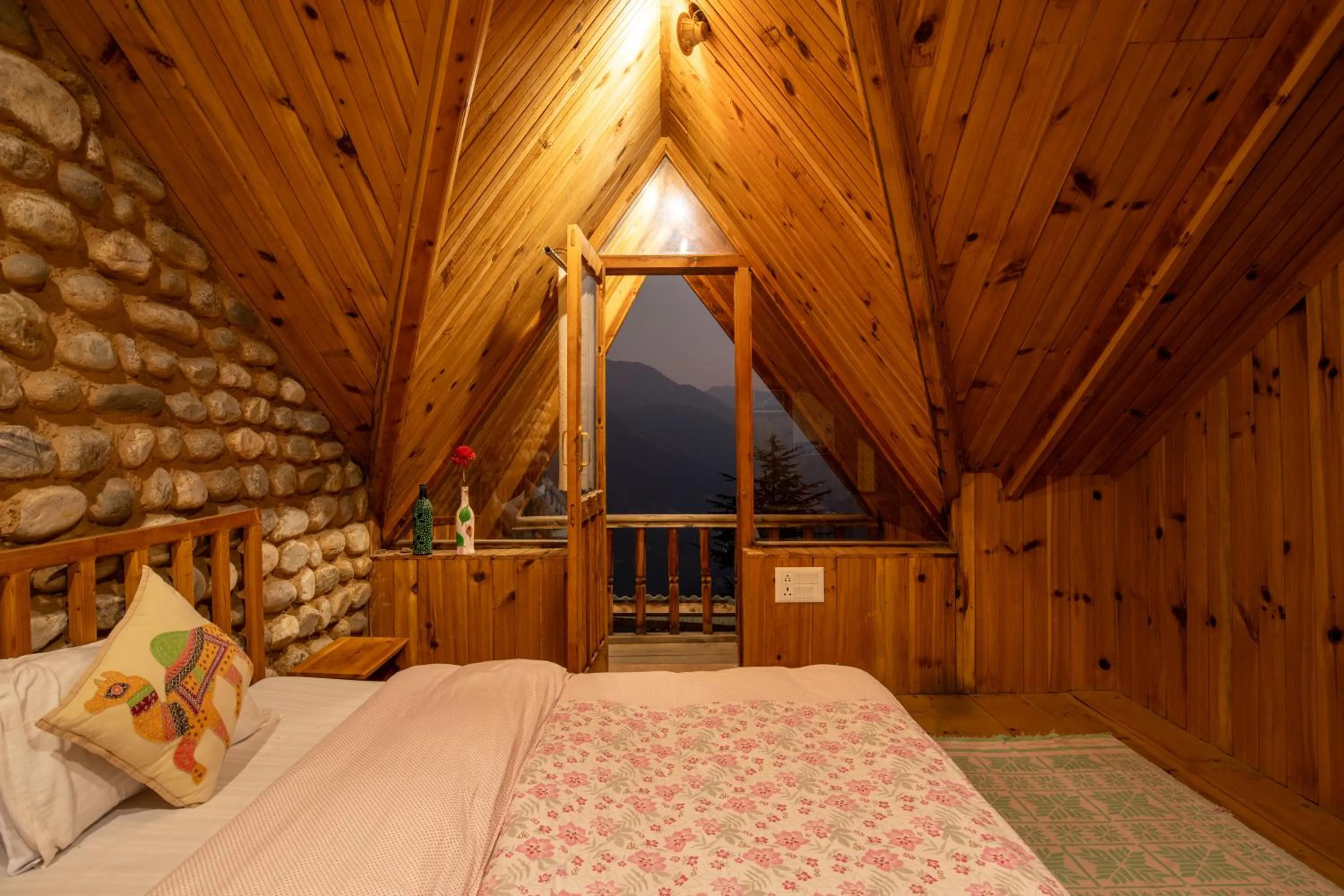 Bed in Ishan Log Huts-A boutique home stay