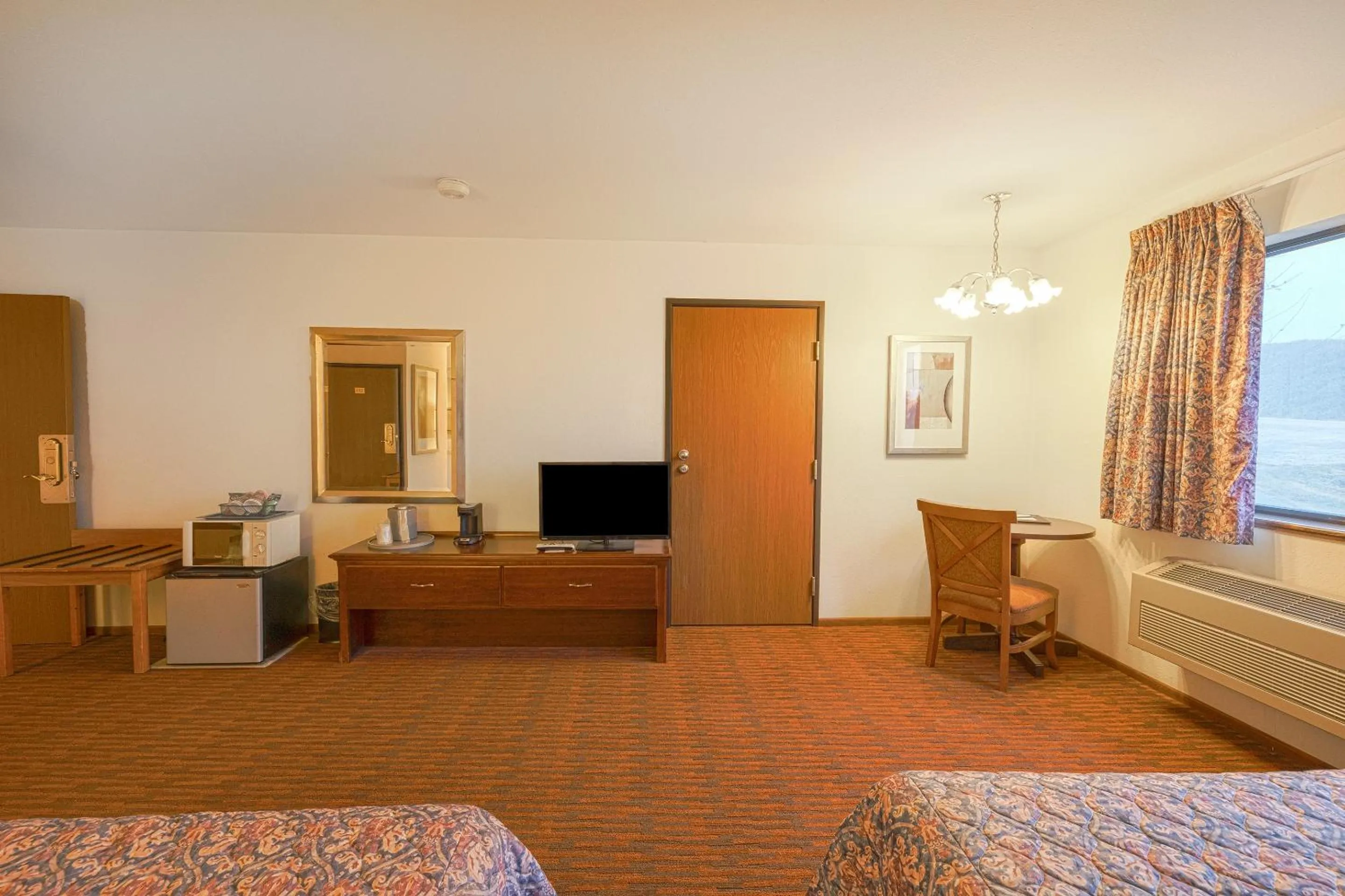 Bedroom in Harlan Inn and Suites By OYO Harlan