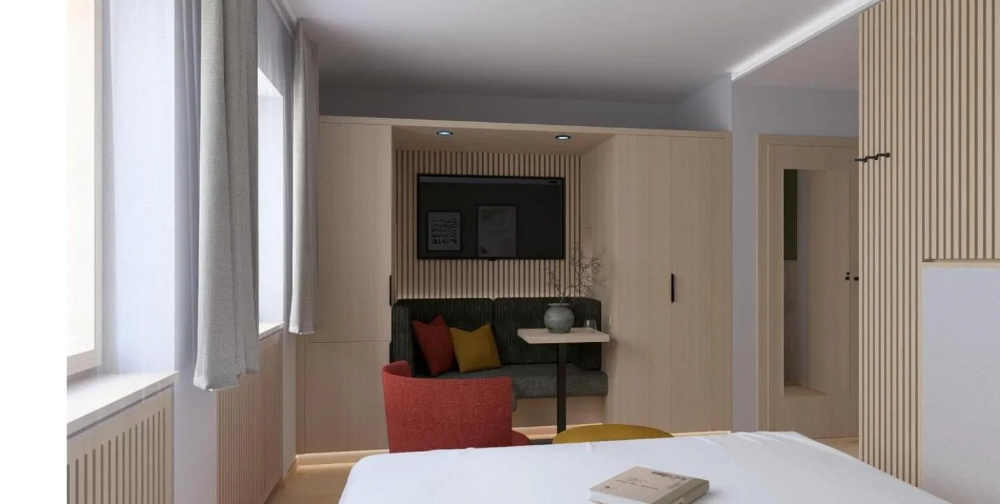 Seating area, Bed in Impuls Hotel Tirol