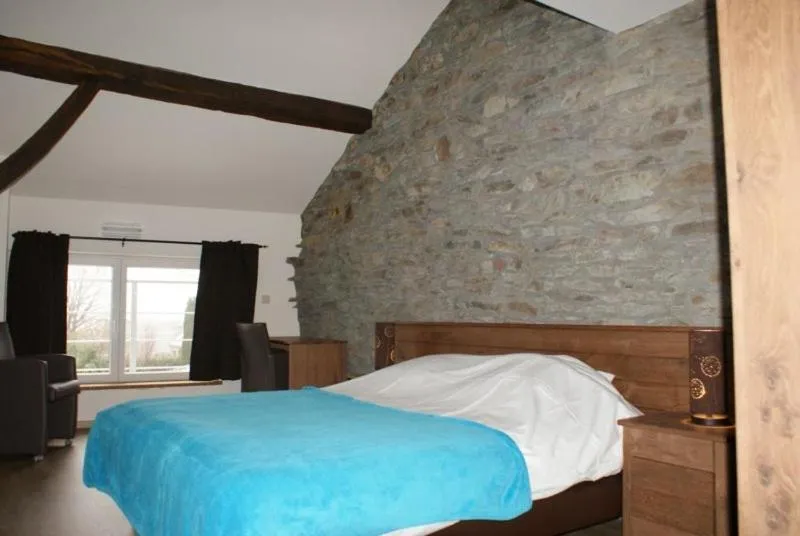 Bed in Auberge Le Temps des Saveurs