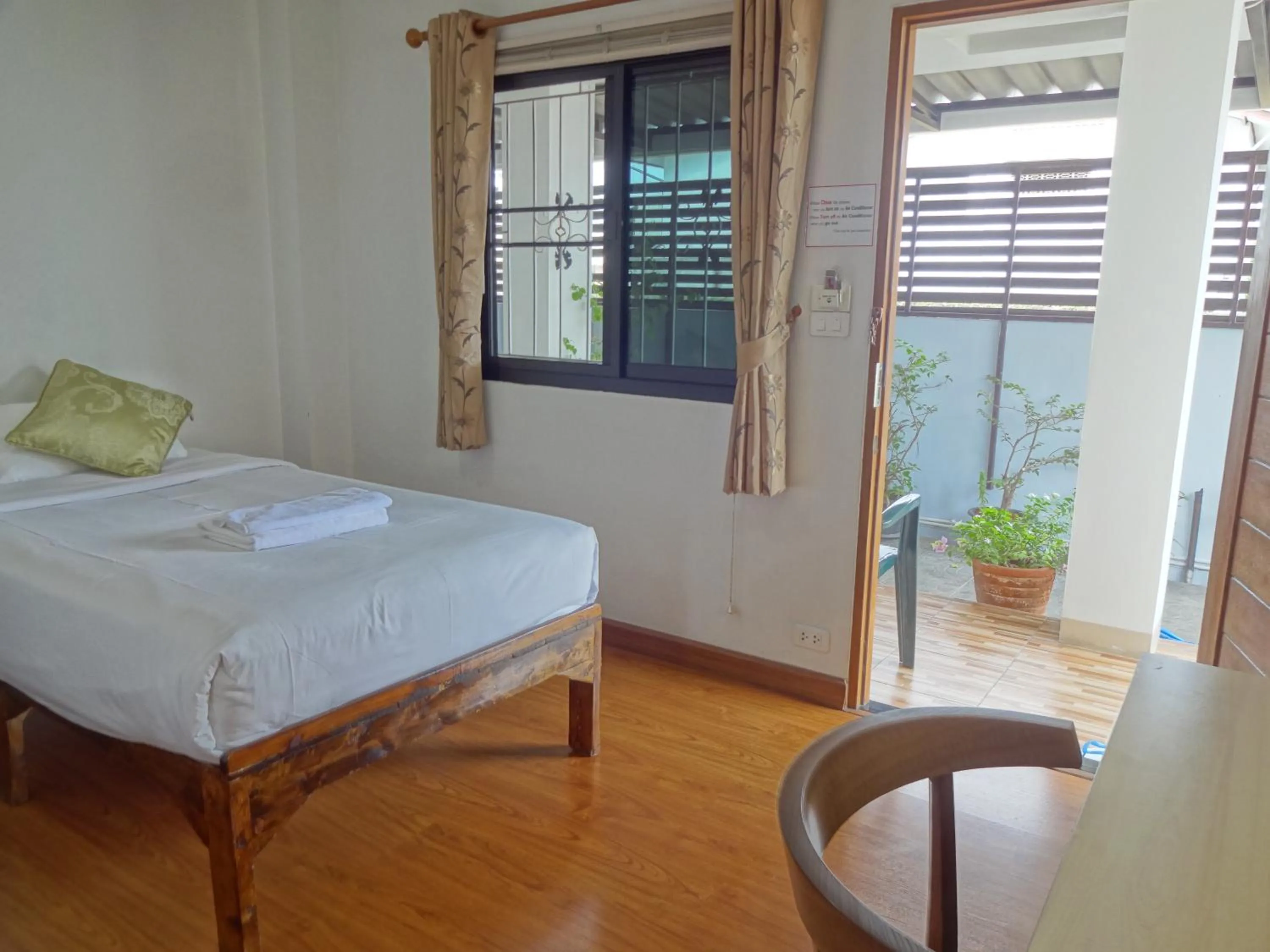 Photo of the whole room, Bed in Rena House Chiang Mai