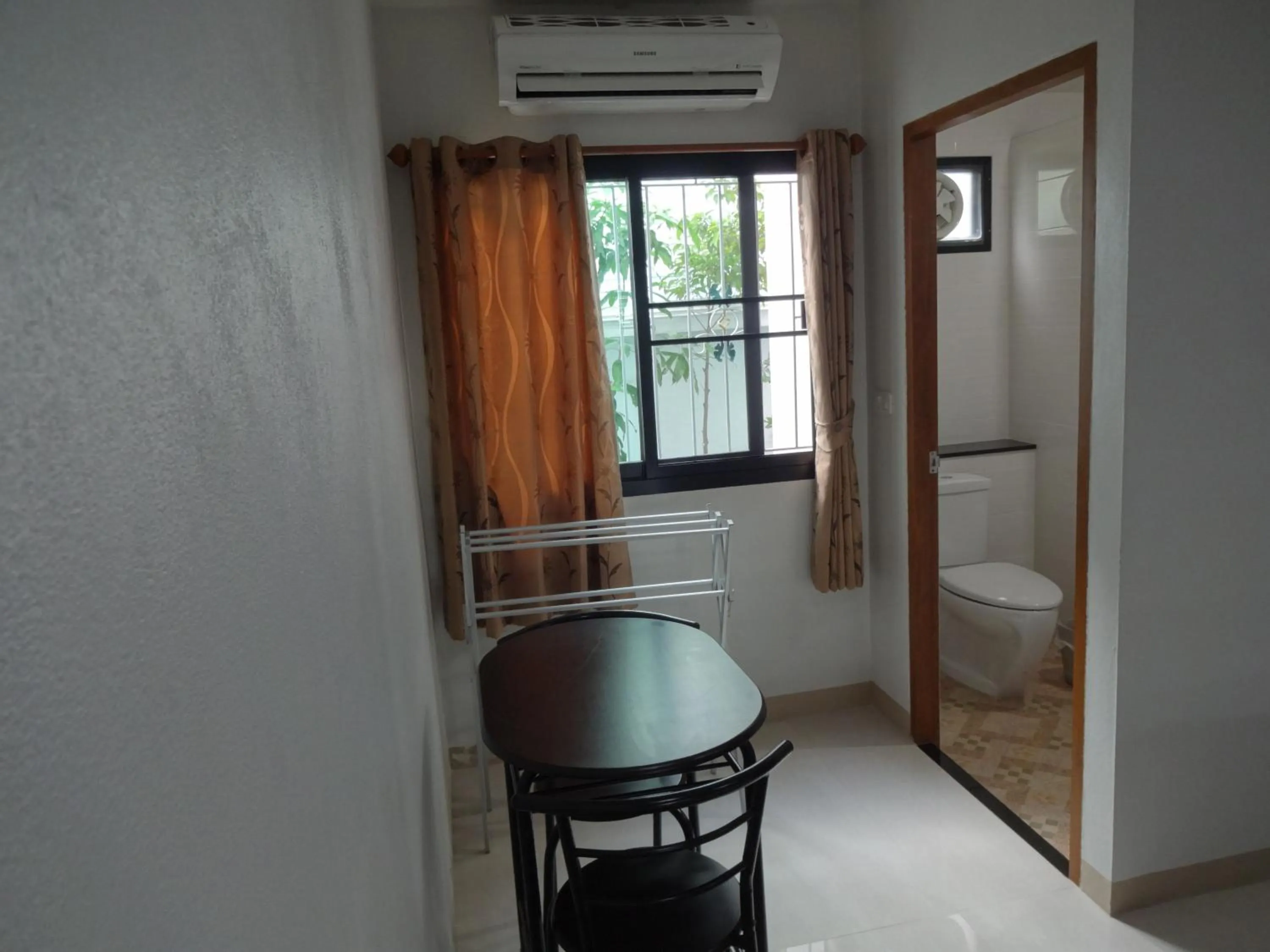 Photo of the whole room, Bed in Rena House Chiang Mai