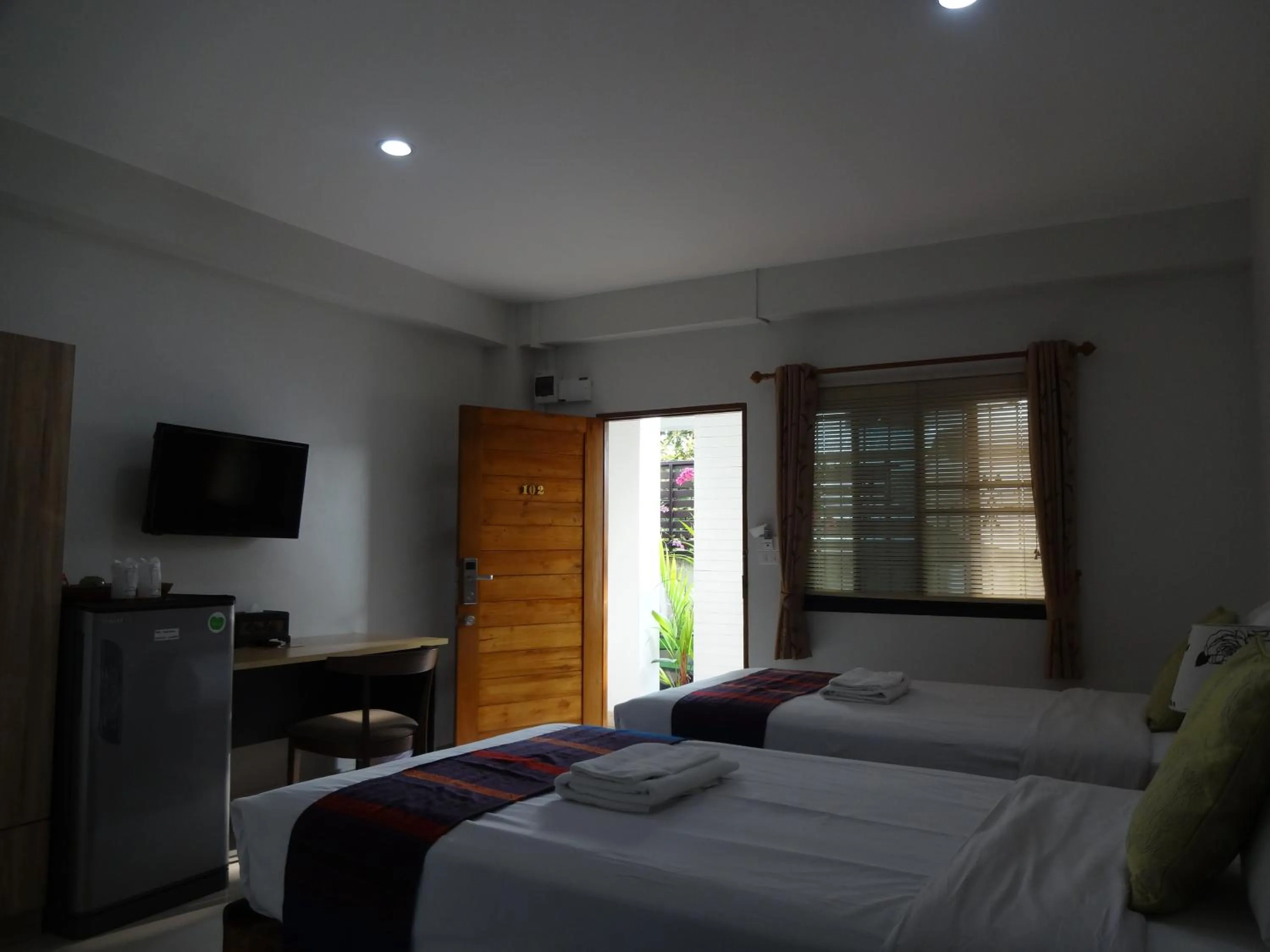 Photo of the whole room, Bed in Rena House Chiang Mai
