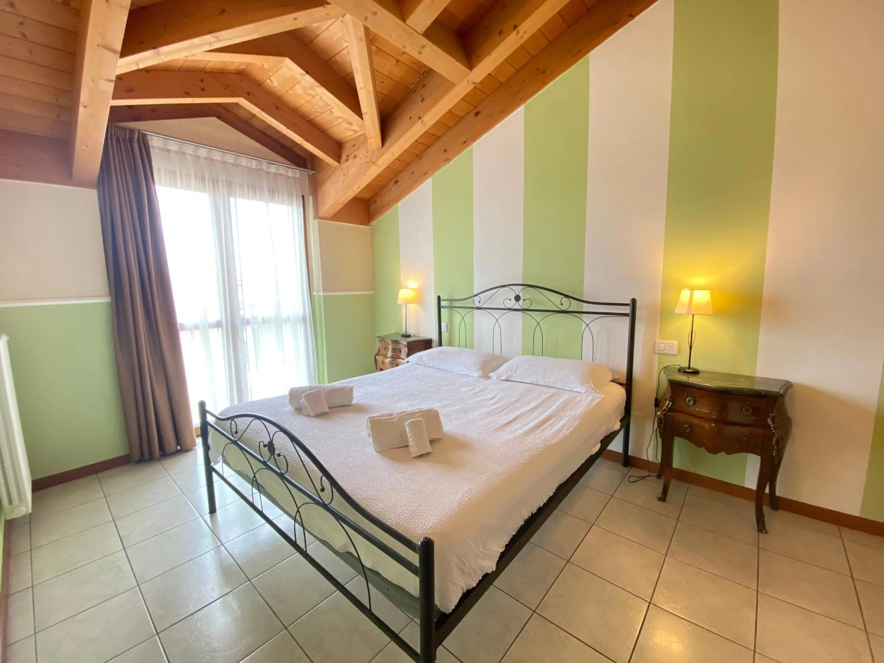 Bed in Ferretti Residence Garda Palace