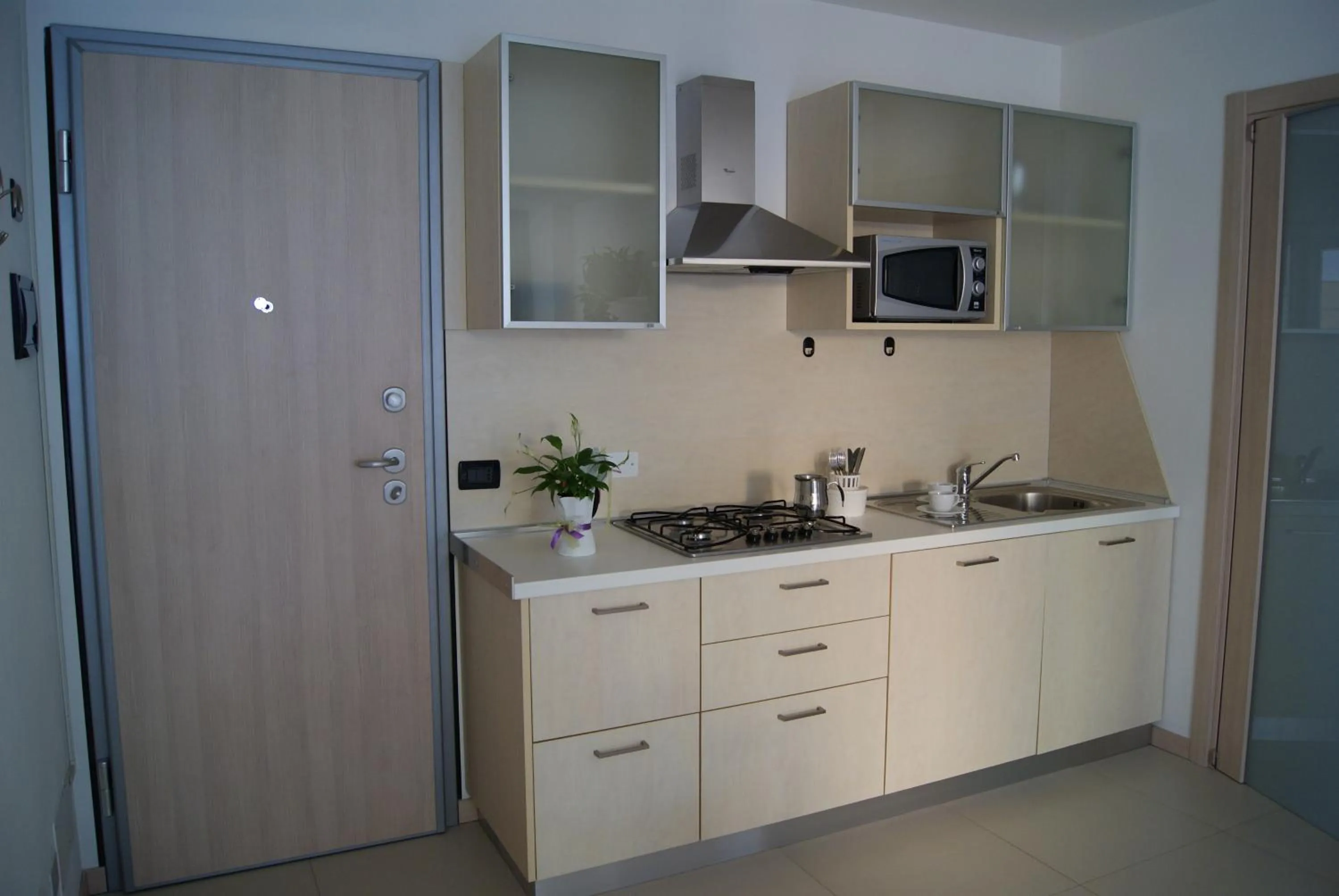 Kitchen or kitchenette in Residence Aprilia