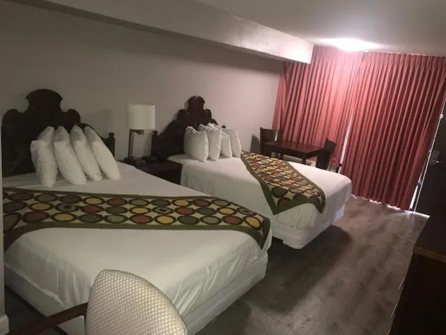 Bed in Alamar Resort Inn