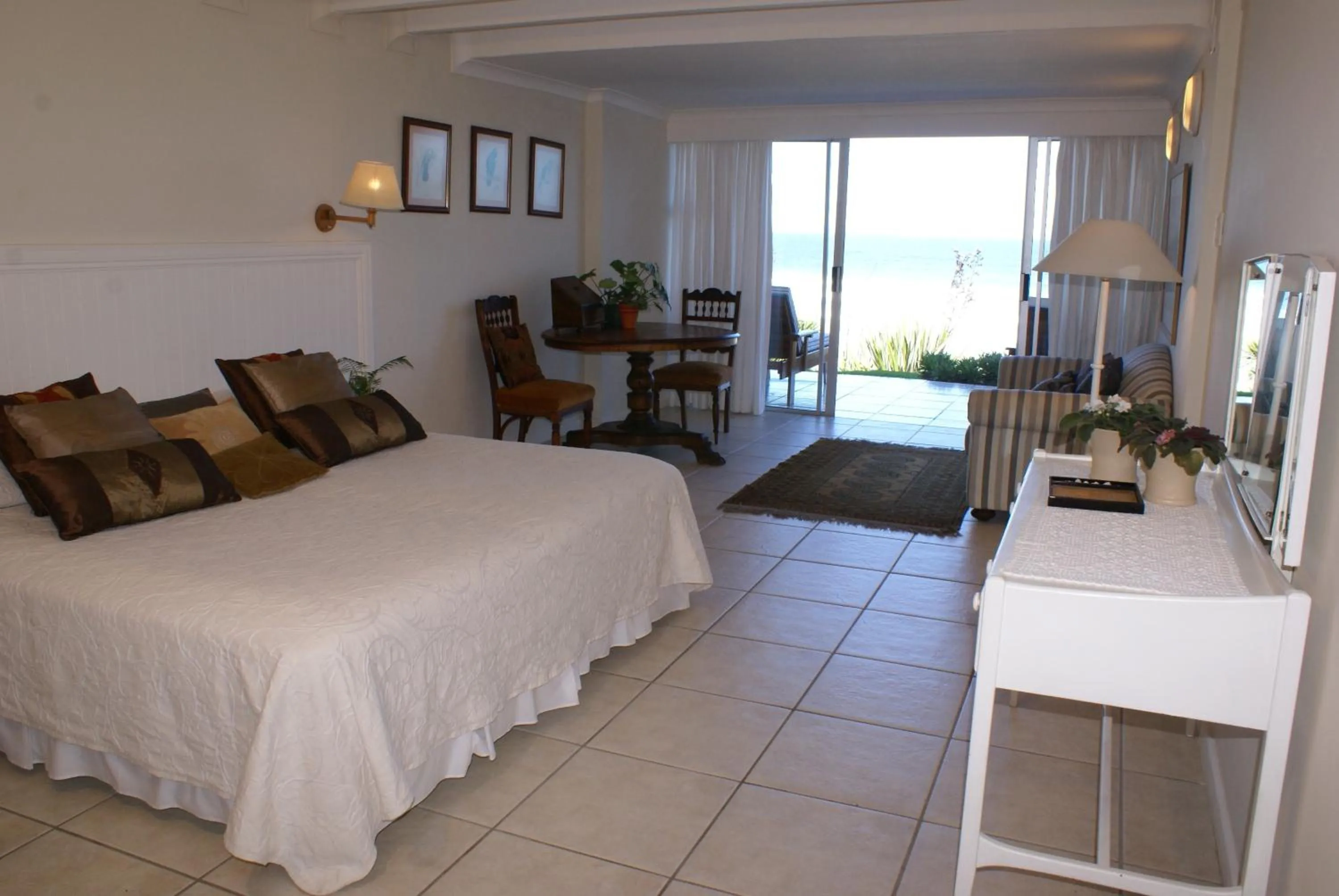 Photo of the whole room, Bed in The Pink Lodge on The Beach