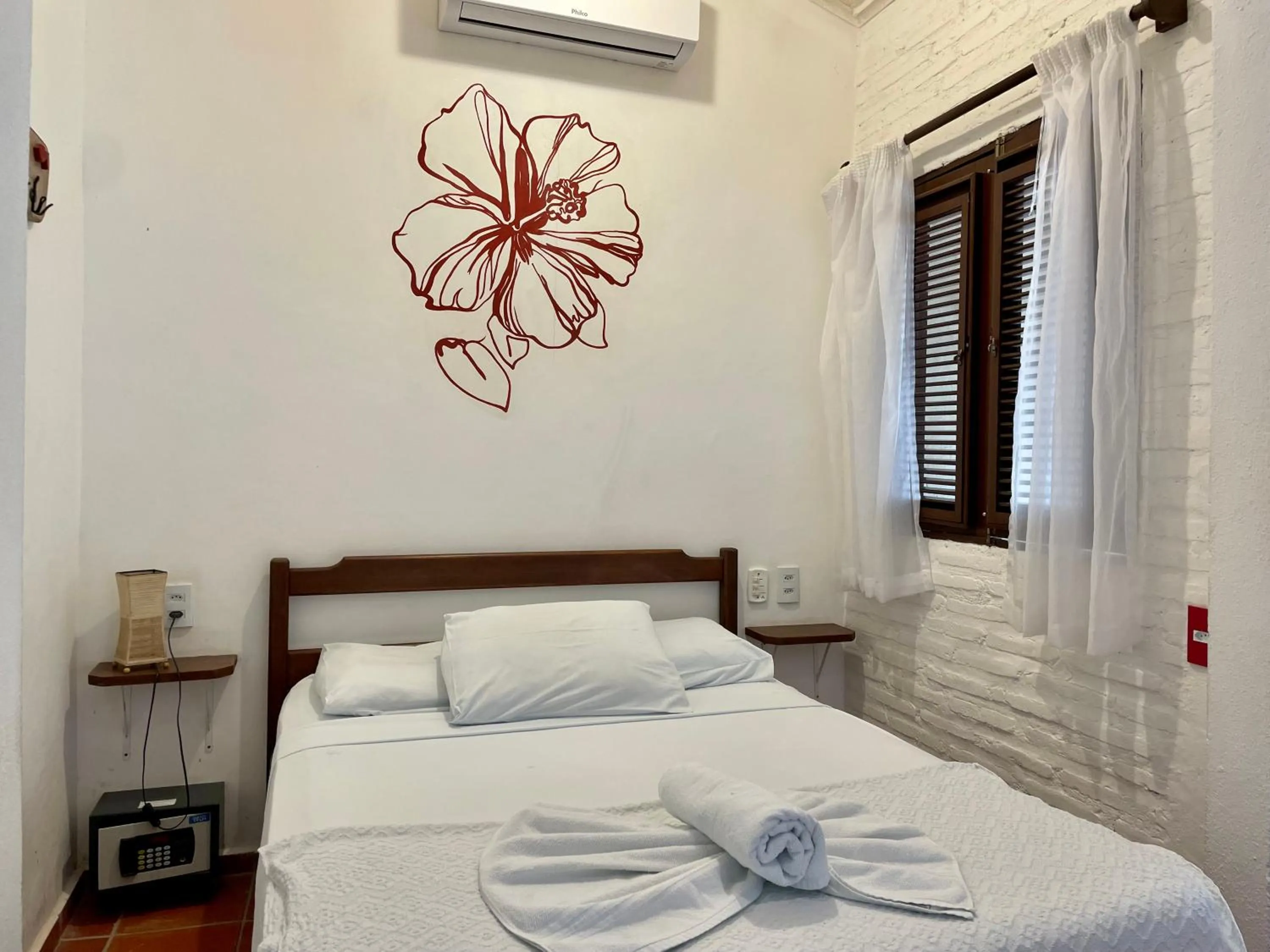 Bed in Pousada Atlantis