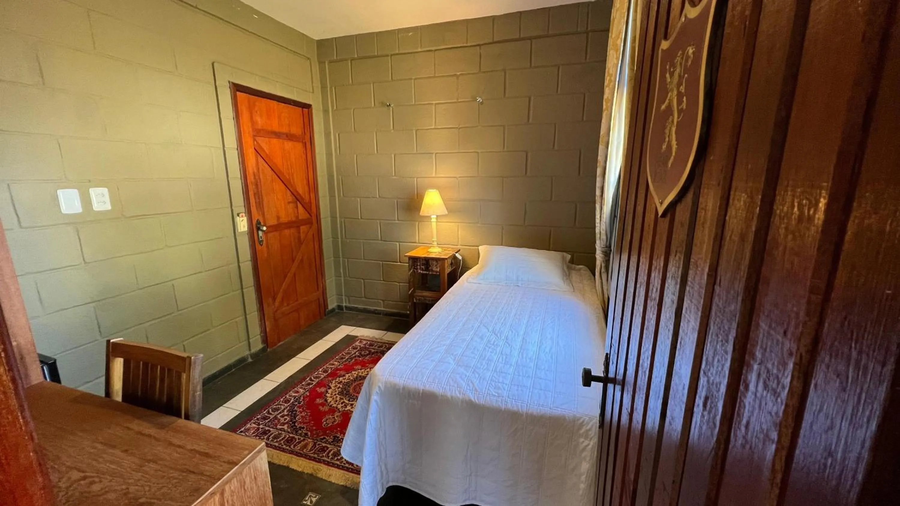 Bed in Pousada Camelot Inn