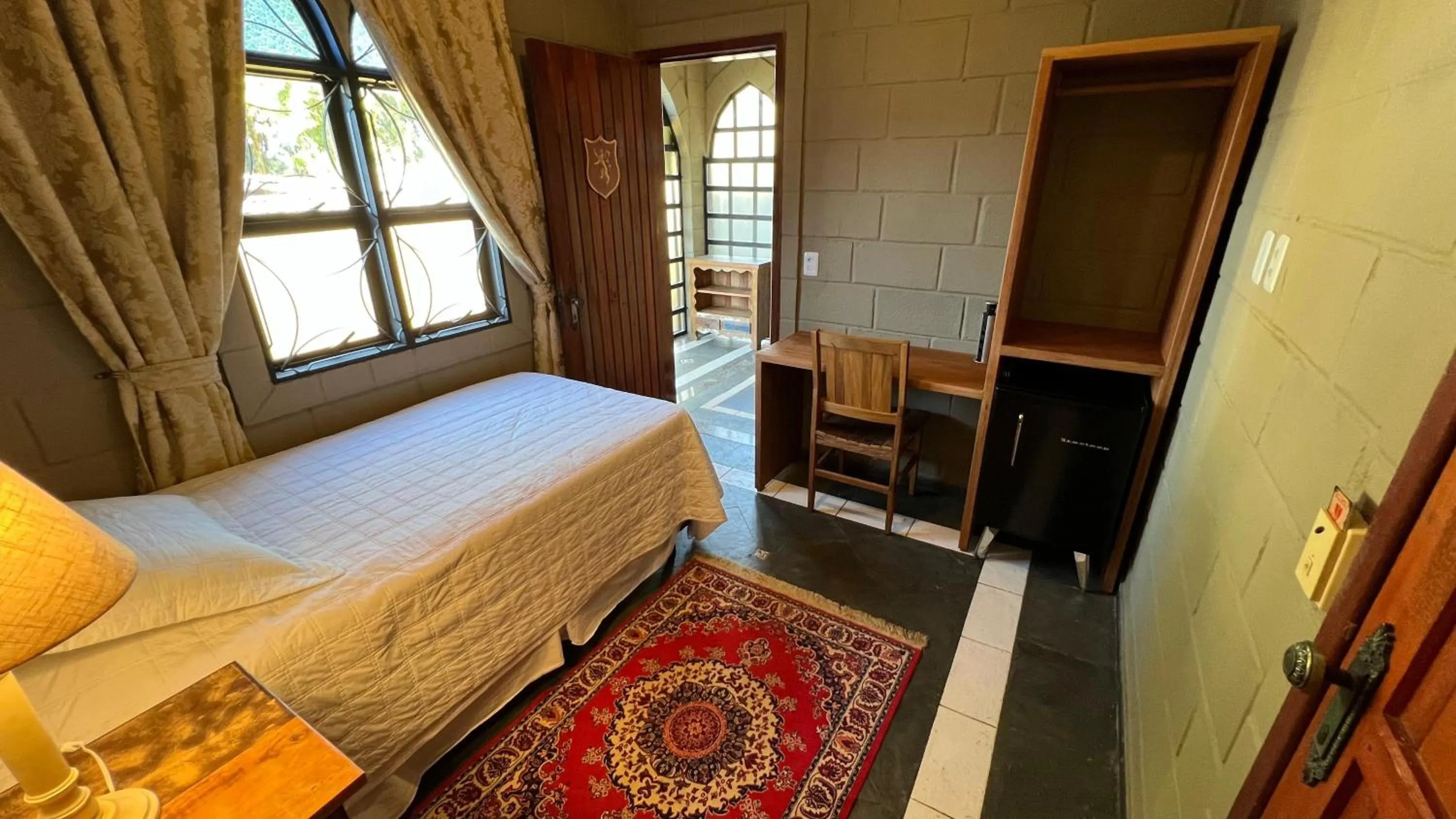 Bed in Pousada Camelot Inn