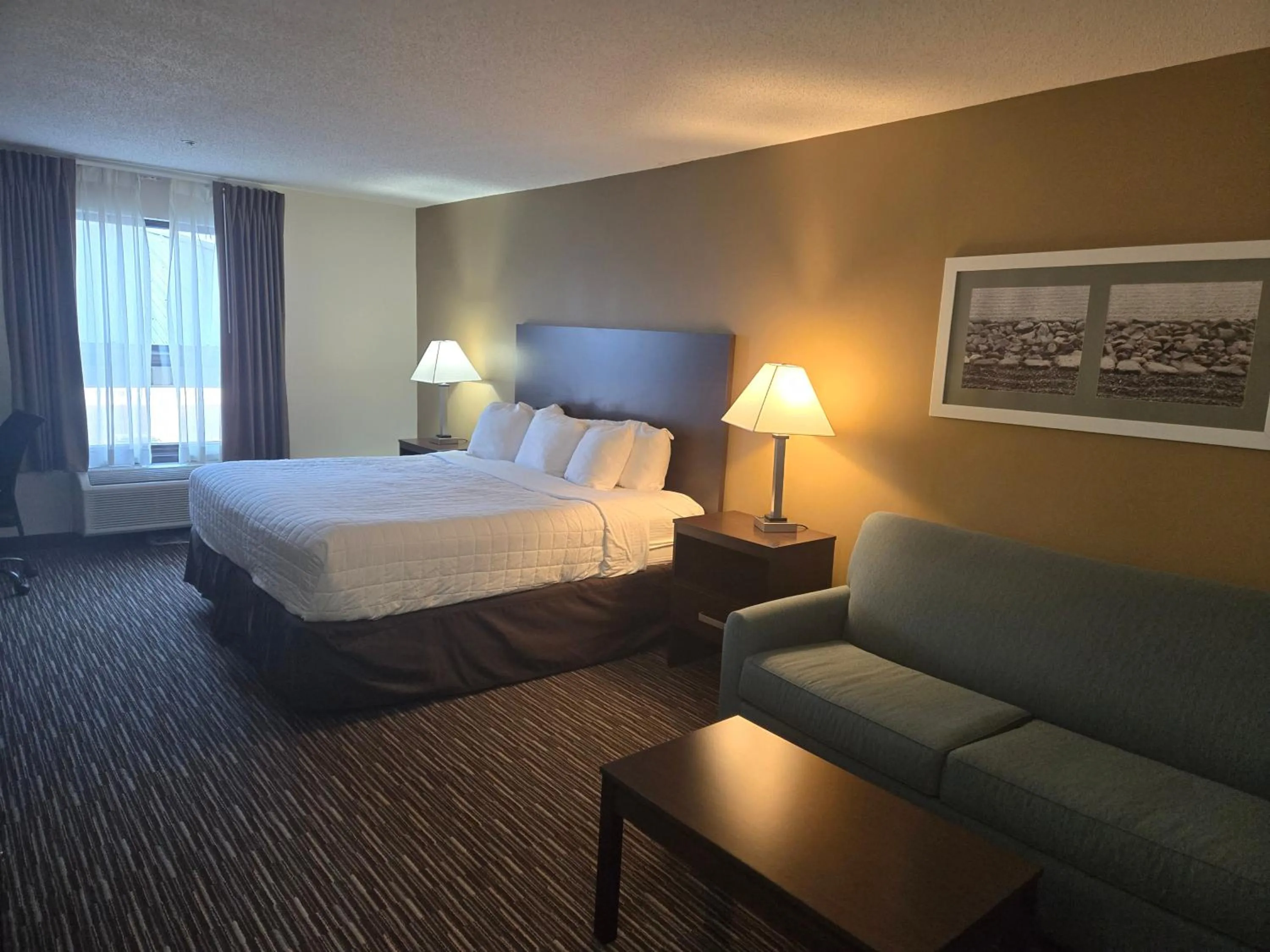 Bed in SureStay by Best Western Grayson